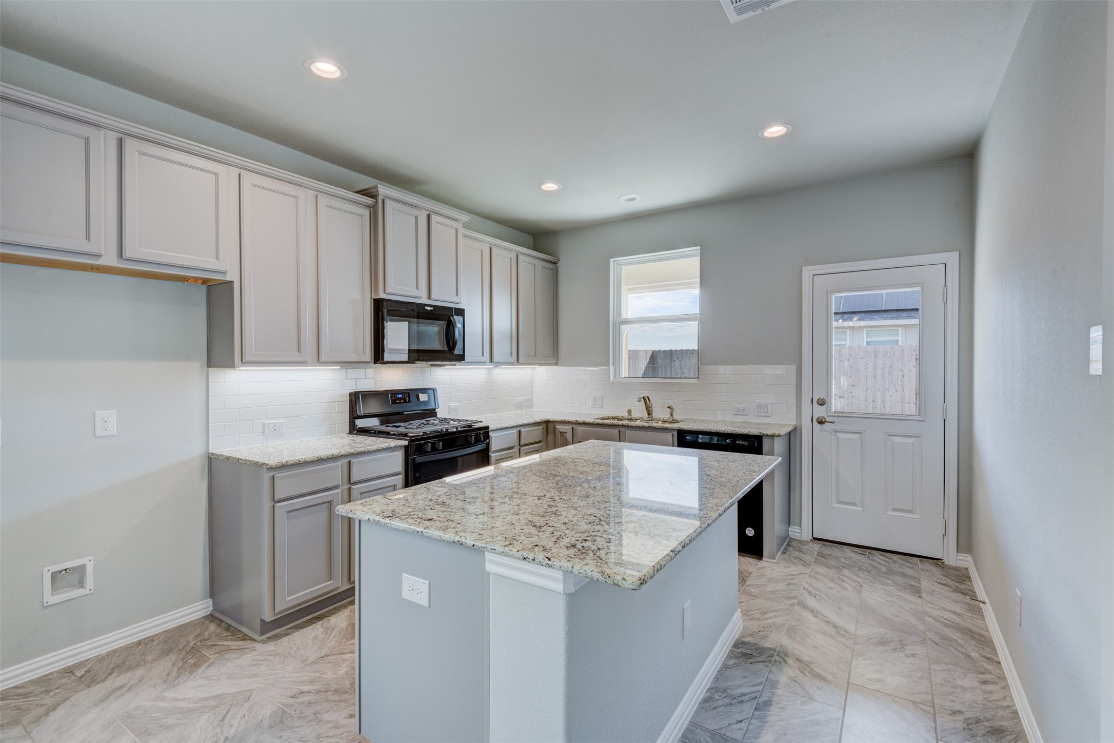 Kitchen offers island bar seating