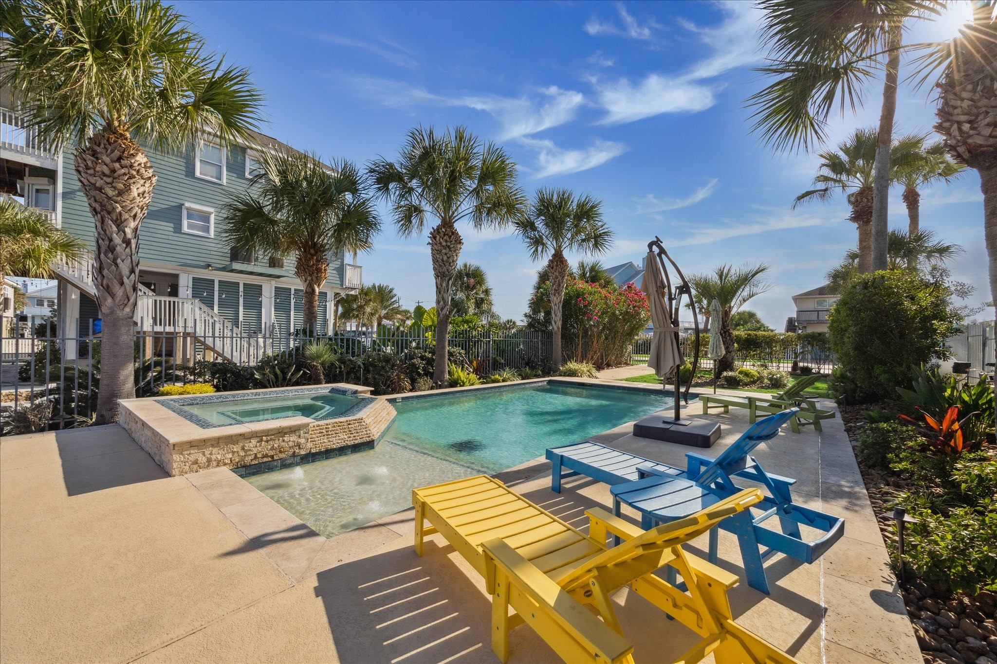 pool has the beach level for the babies and dog swimmers