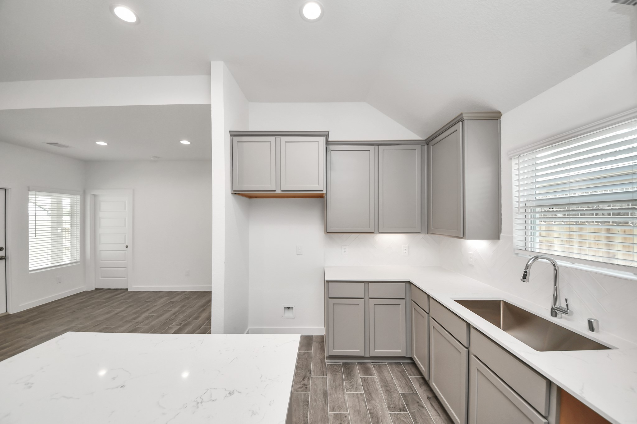 The extended counter area adds both practicality and style, making meal preparation a breeze. Every detail is thoughtfully designed to enhance the kitchen's functionality and aesthetic appeal. Sample photo of completed home with similar floor plan. Actual colors and selections may vary.