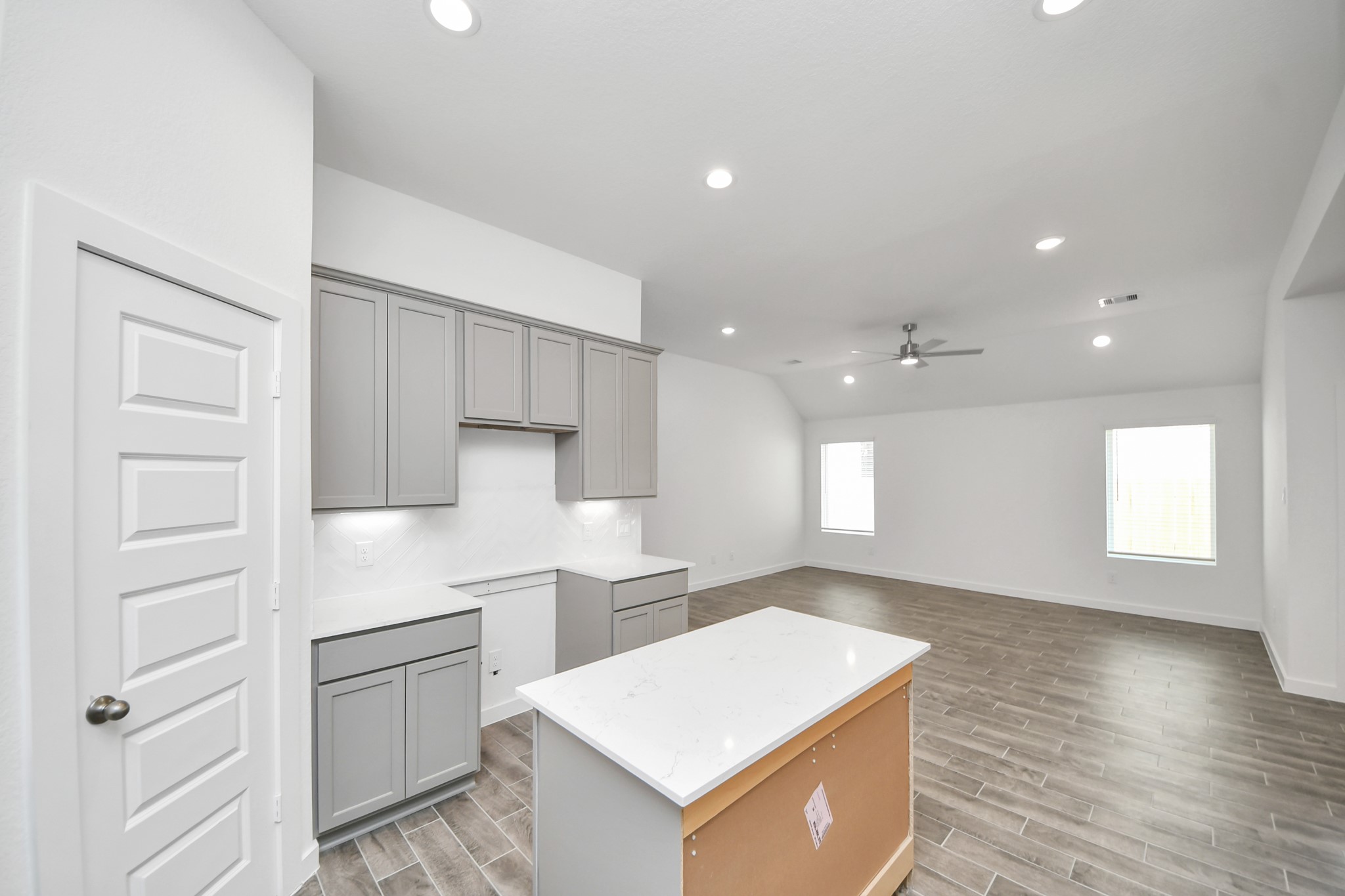 The open concept effortlessly connects the kitchen to the expansive family room, forming a perfect hub for gatherings. This seamless flow creates an inviting space where cooking and socializing come together harmoniously. Sample photo of completed home with similar floor plan. Actual colors and selections may vary.