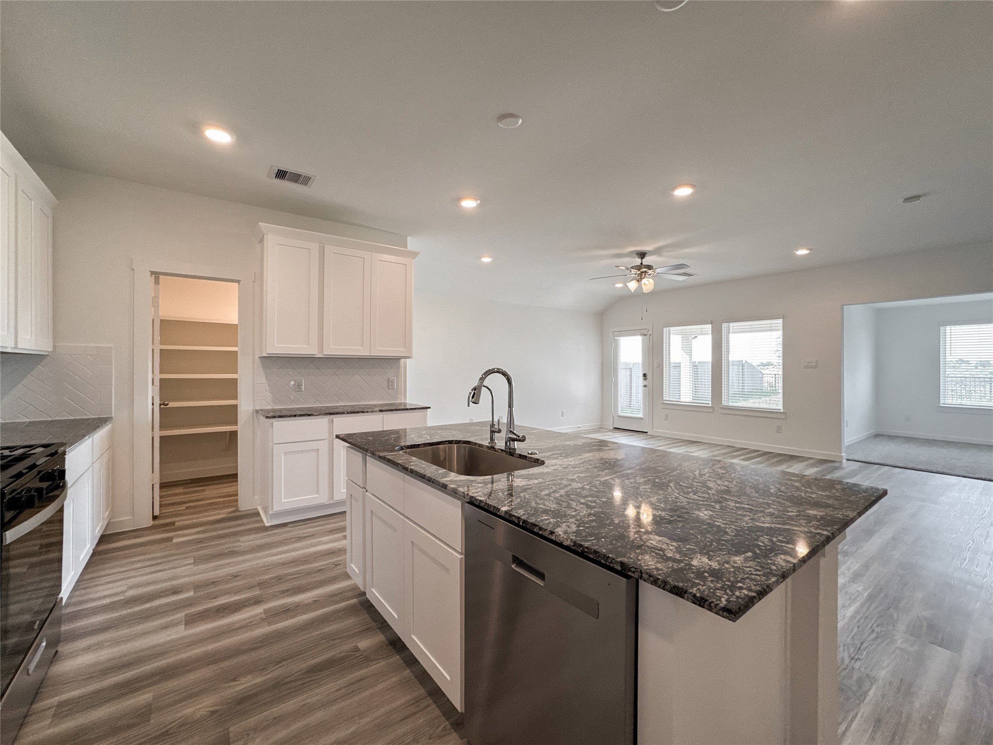 Kitchen overlooking Living Space and lovely backyard