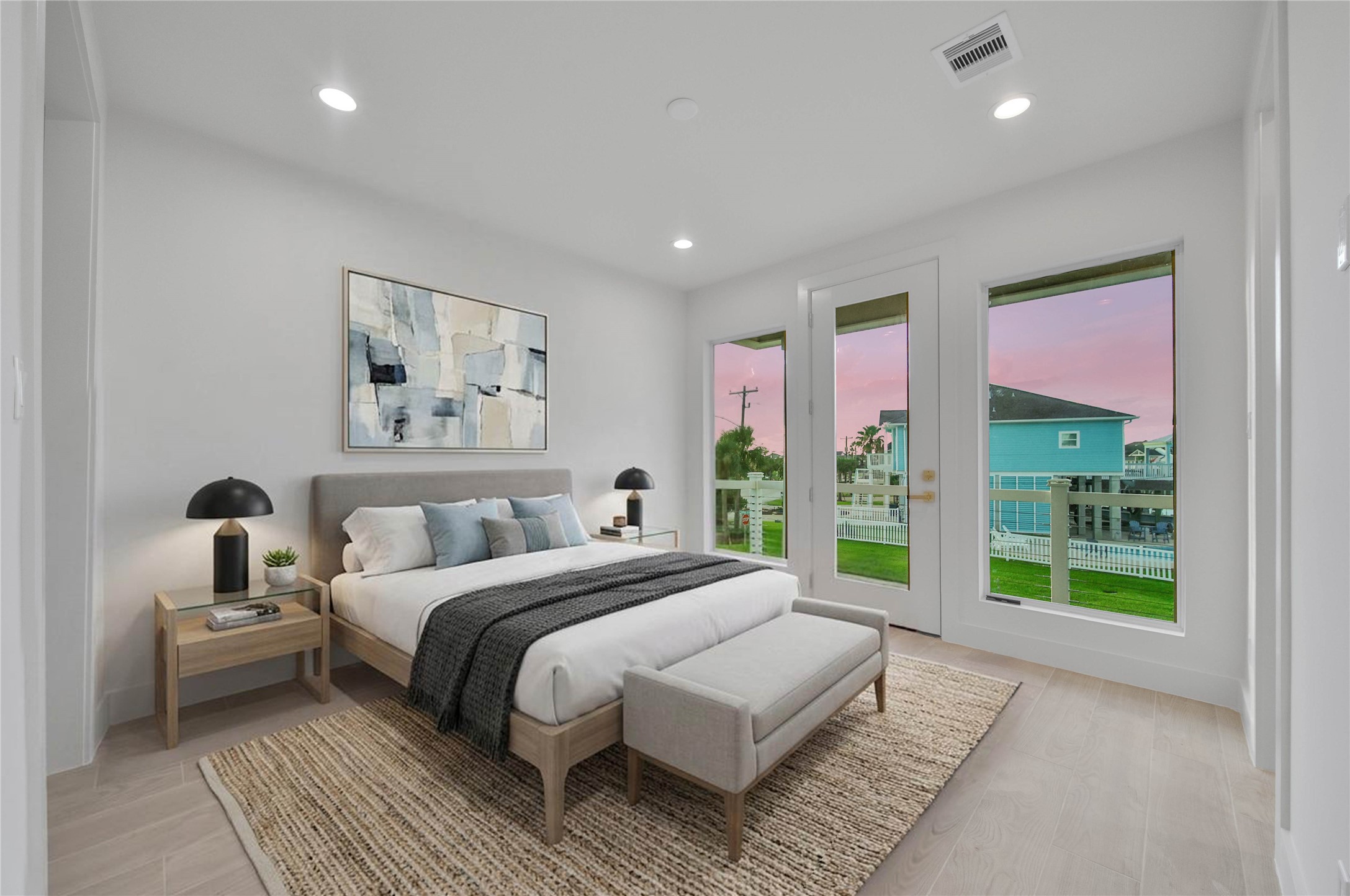 One of Four spacious secondary bedrooms offering light floors, high ceilings, recessed lighting, en suite and access to exterior balcony. *virtually staged*