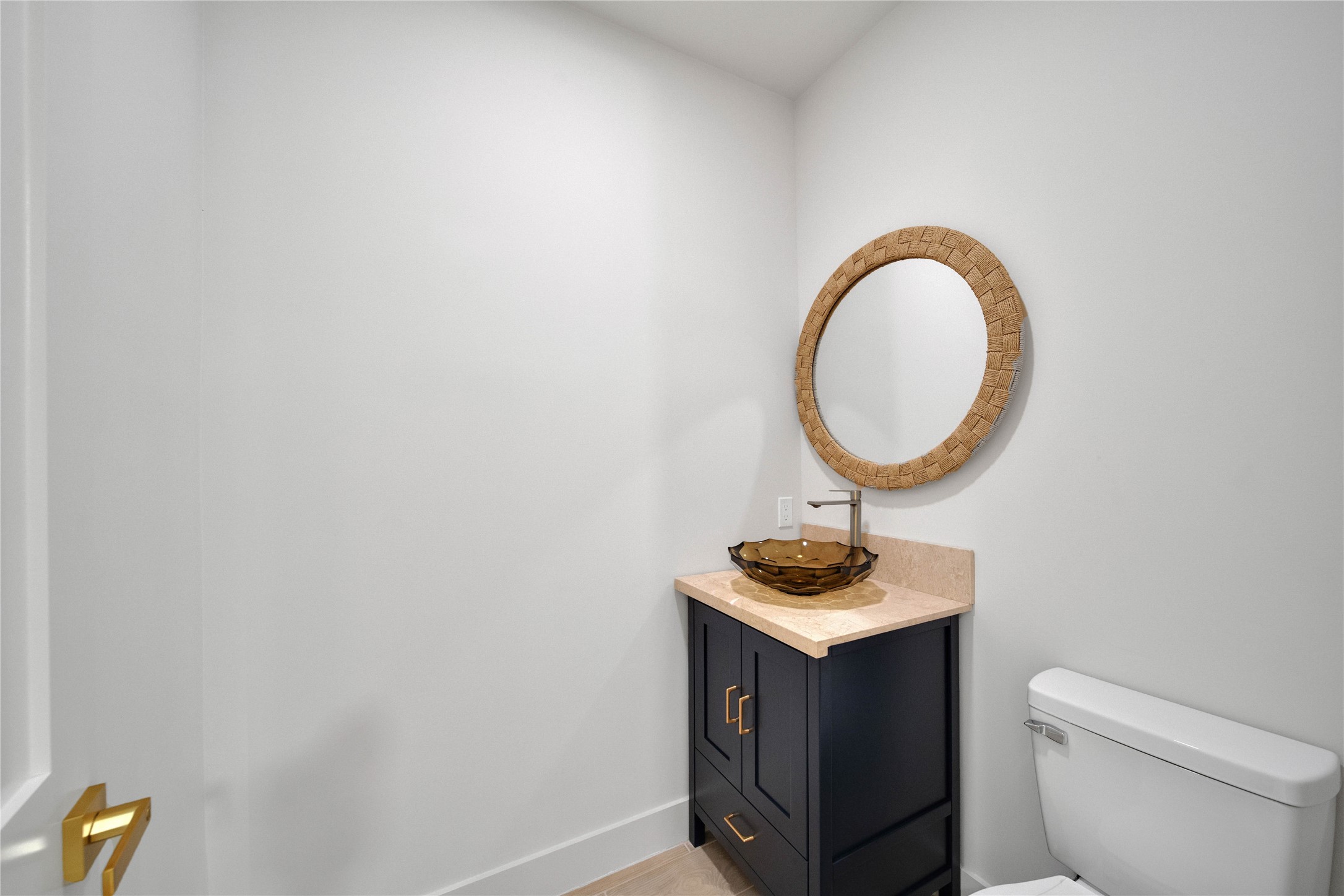 Convenient half bath located by the entertaining spaces for guest.