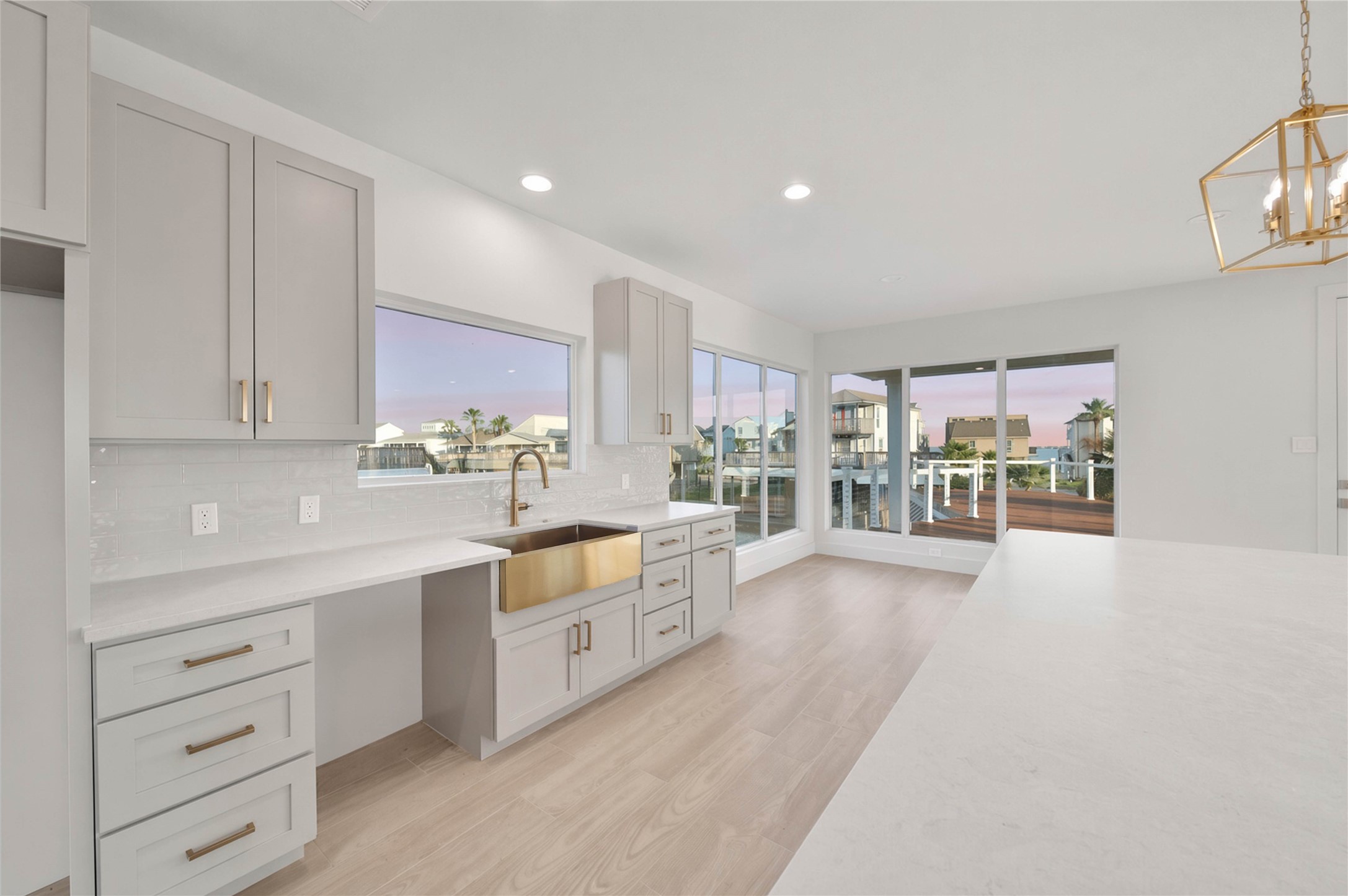 Bright kitchen with abundant cabinetry and an open connection to the surrounding living spaces.