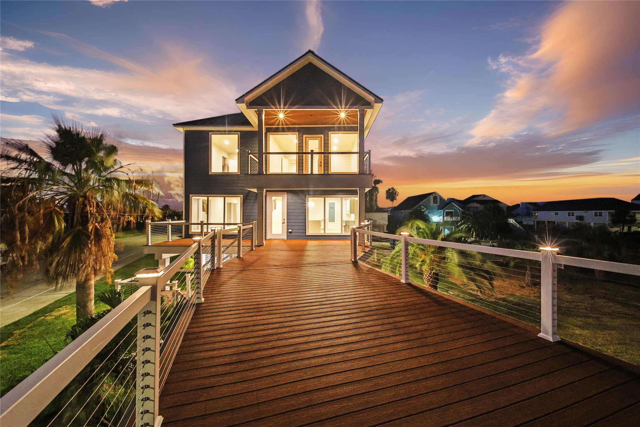Expansive 12,000+ sqft corner lot on the desired protected canal side with multiple decks and private boat dock.