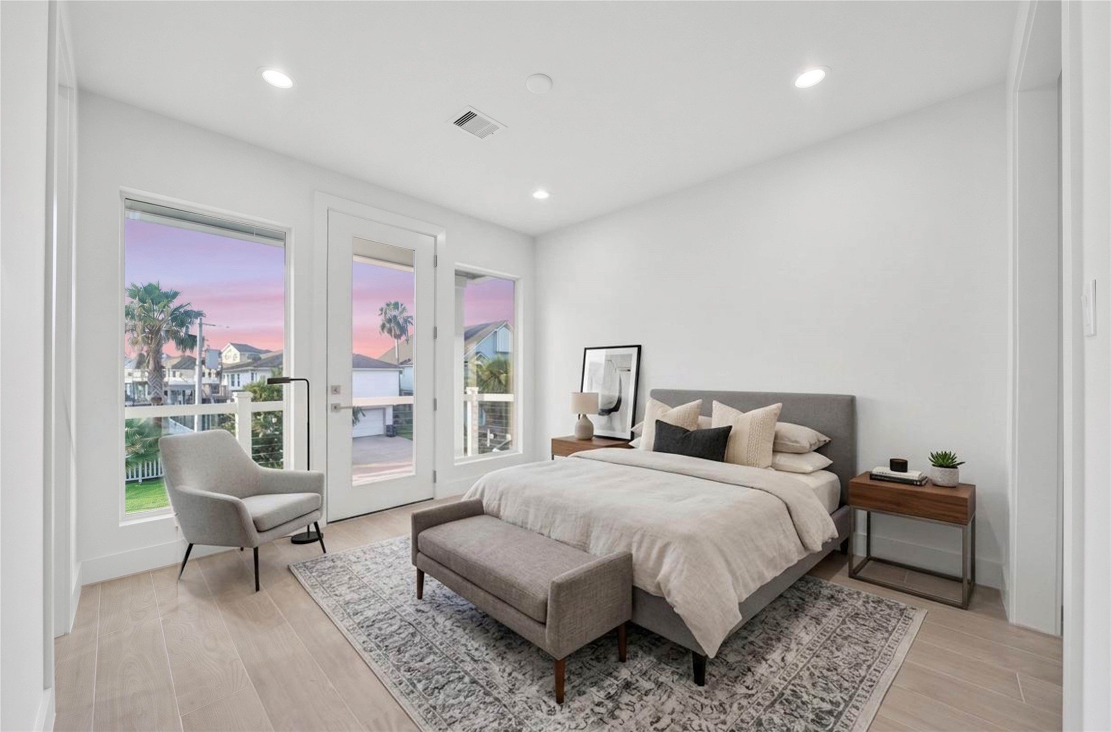 One of Four spacious secondary bedrooms offering light floors, high ceilings, recessed lighting, en suite and access to exterior balcony. *virtually staged*