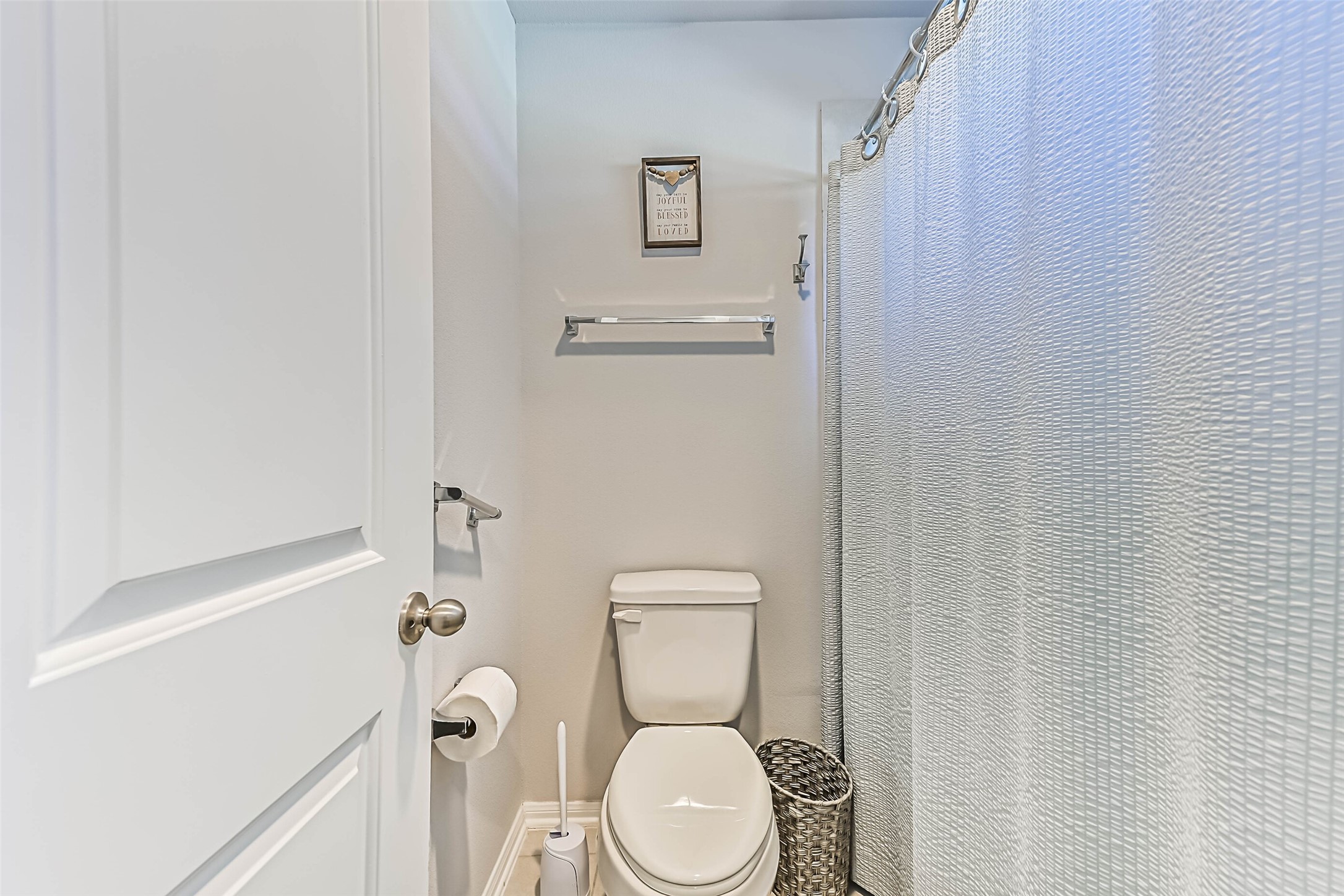Separate shower and toilet area conveniently located off the dual-vanity bathroom.