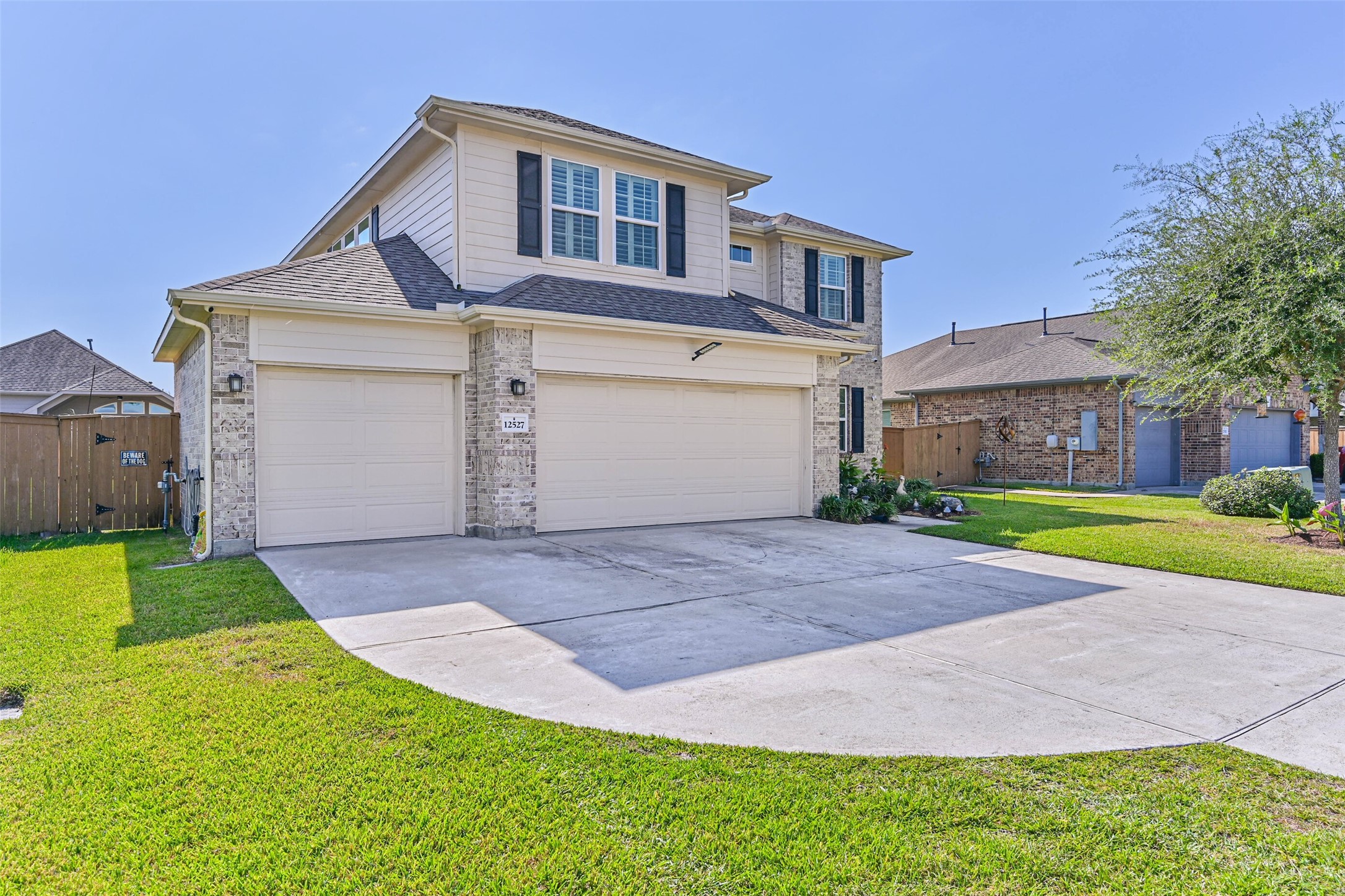 Beautiful two-story home featuring a combination of brick and siding, attractive curb appeal, and a three-car garage.