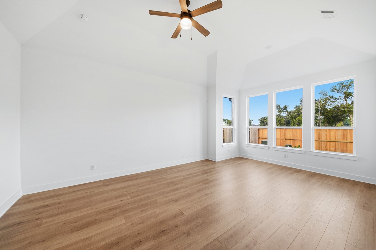 Private primary suite with vaulted ceilings, oversized windows, and plenty of room to unwind.