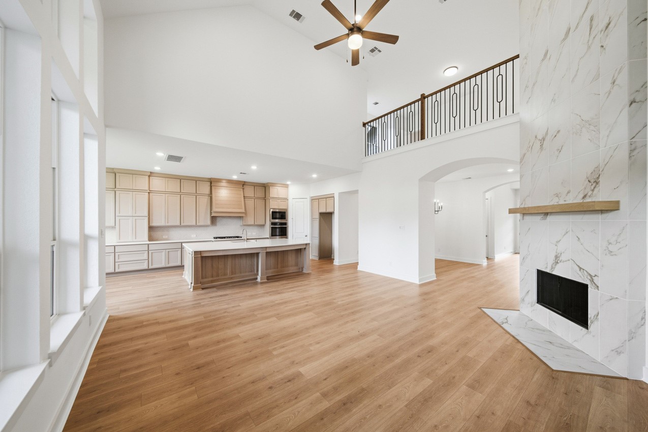 Spacious family room seamlessly connected to the kitchen, creating an ideal gathering space.