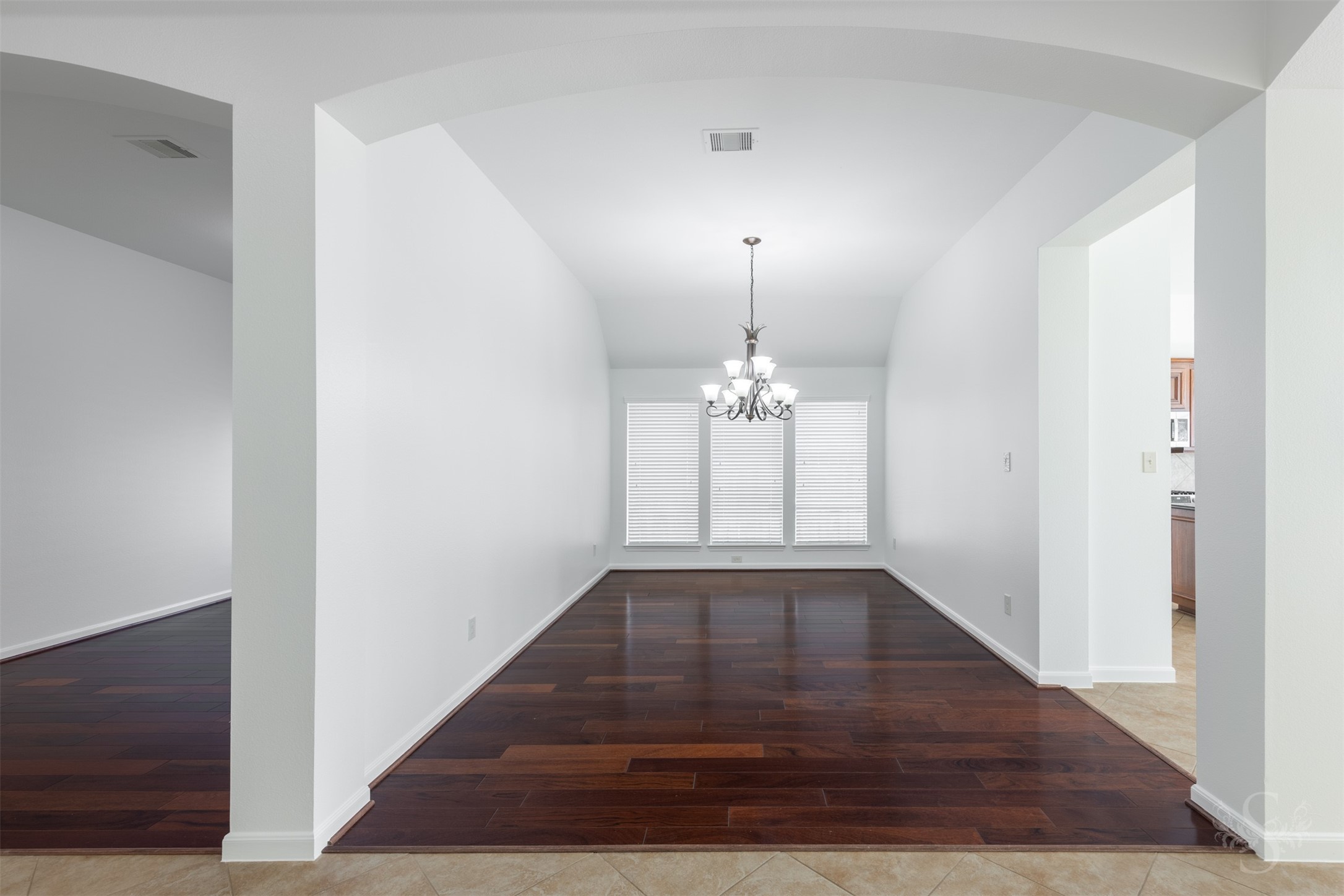 The formal dining room features rich wood floors, high ceilings and a wall of windows that fills the space with soft natural light. Generous proportions and an open connection to the kitchen make it ideal for both everyday meals and hosting guests. The formal dining room features rich wood floors, high ceilings and a wall of windows that fills the space with soft natural light. Generous proportions and an open connection to the kitchen make it ideal for both everyday meals and hosting guests.