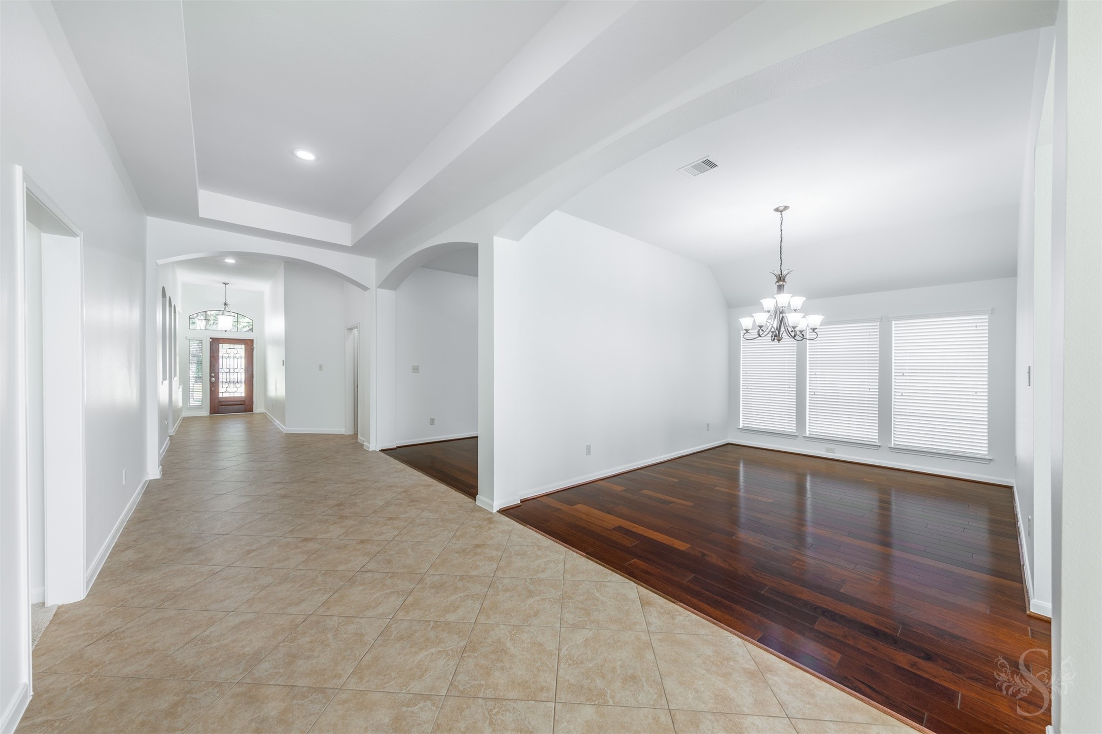 A welcoming gallery-style entry with tray ceiling and graceful archways creates an impressive first impression from the moment you step inside. The open layout offers a seamless flow into the main living areas while providing a glimpse into the spacious study and dining room just off the foyer. A welcoming gallery-style entry with tray ceiling and graceful archways creates an impressive first impression from the moment you step inside. The open layout offers a seamless flow into the main living areas while providing a glimpse into the spacious study and dining room just off the foyer.