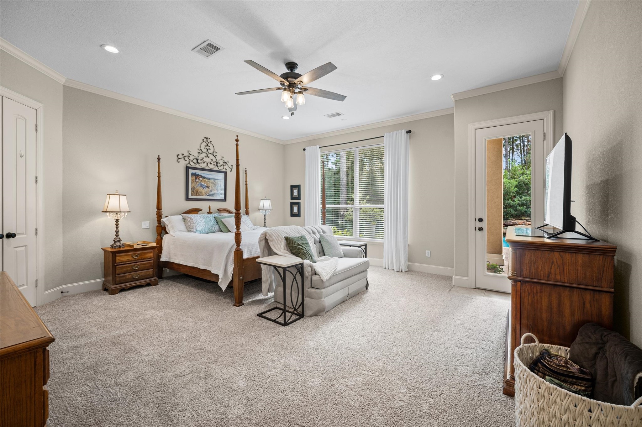 Huge primary bedroom with a door to the outside to enjoy the oasis backyard.