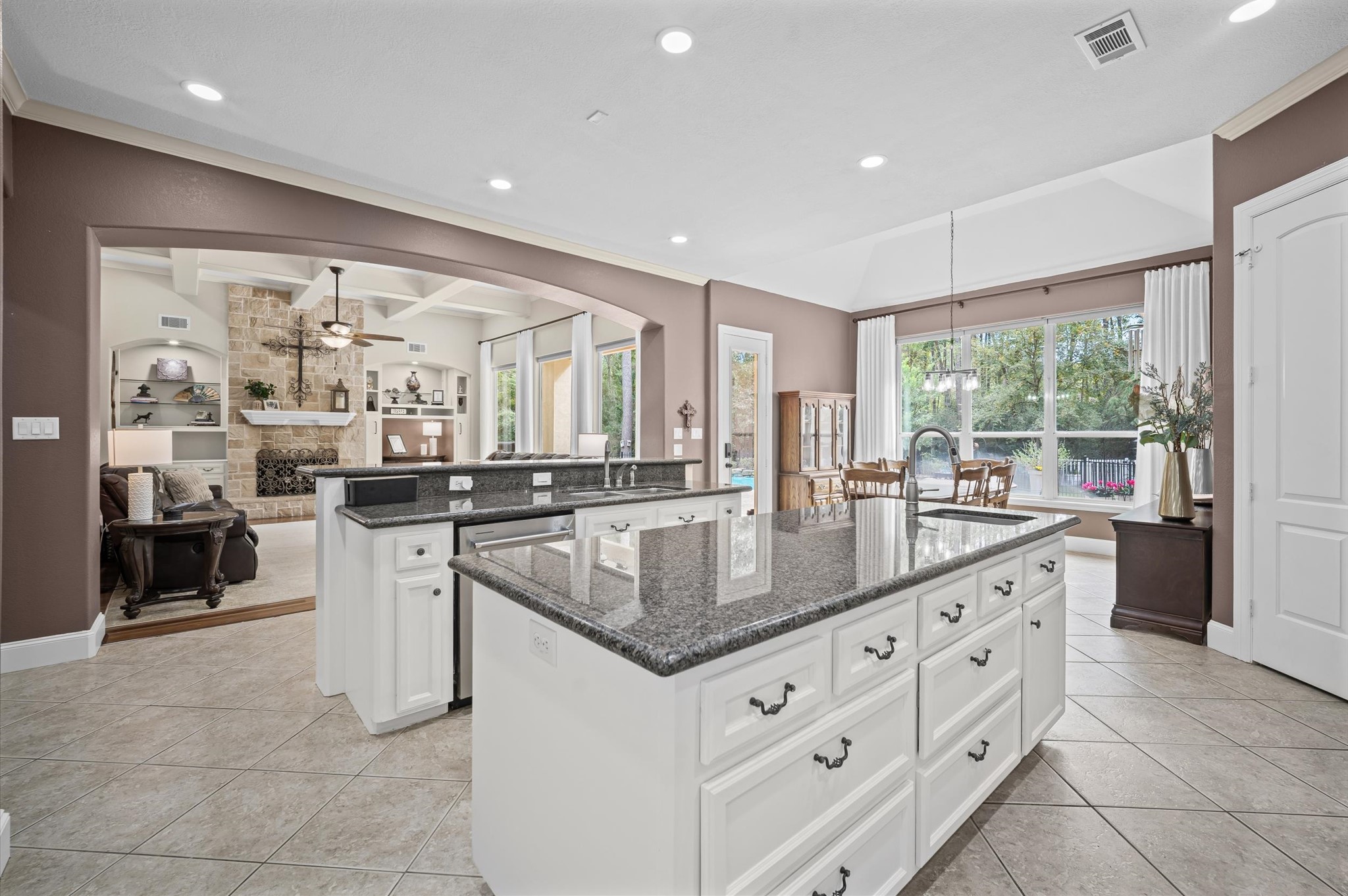 Spacious island kitchen opening to the formal dining and living areas