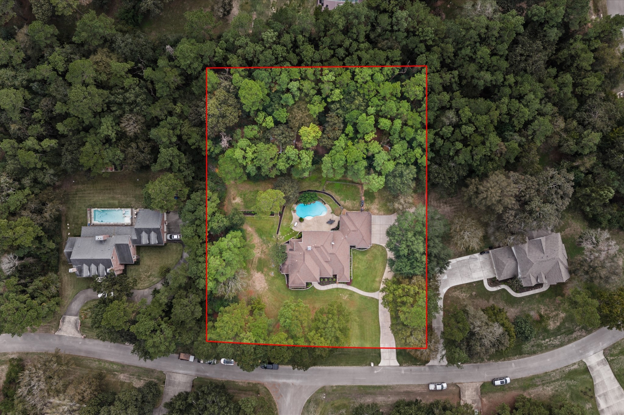 Aerial view showcasing the spacious 1.45-acre wooded homesite