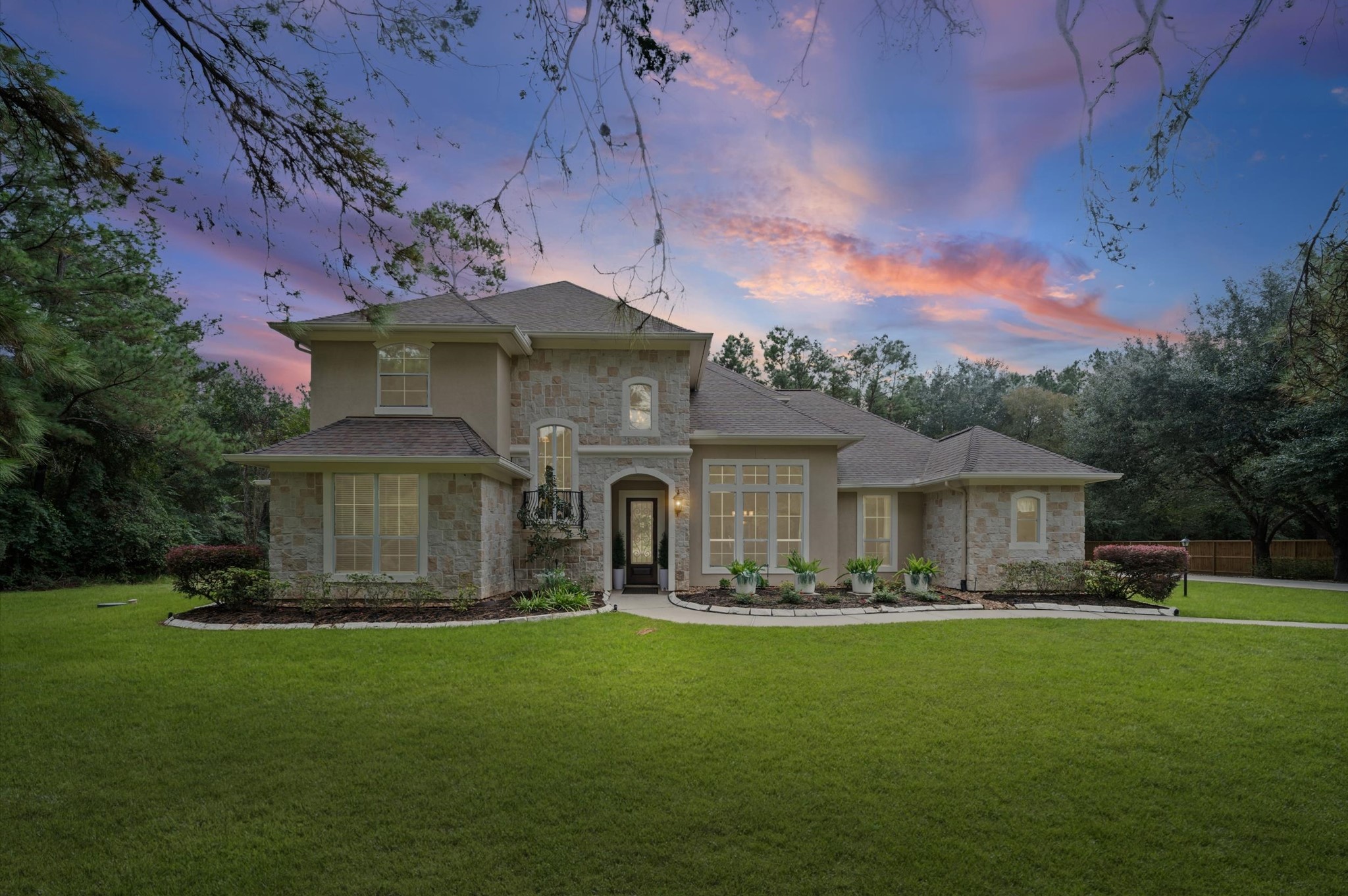 Gorgeous twilight exterior showcasing the home's timeless architecture