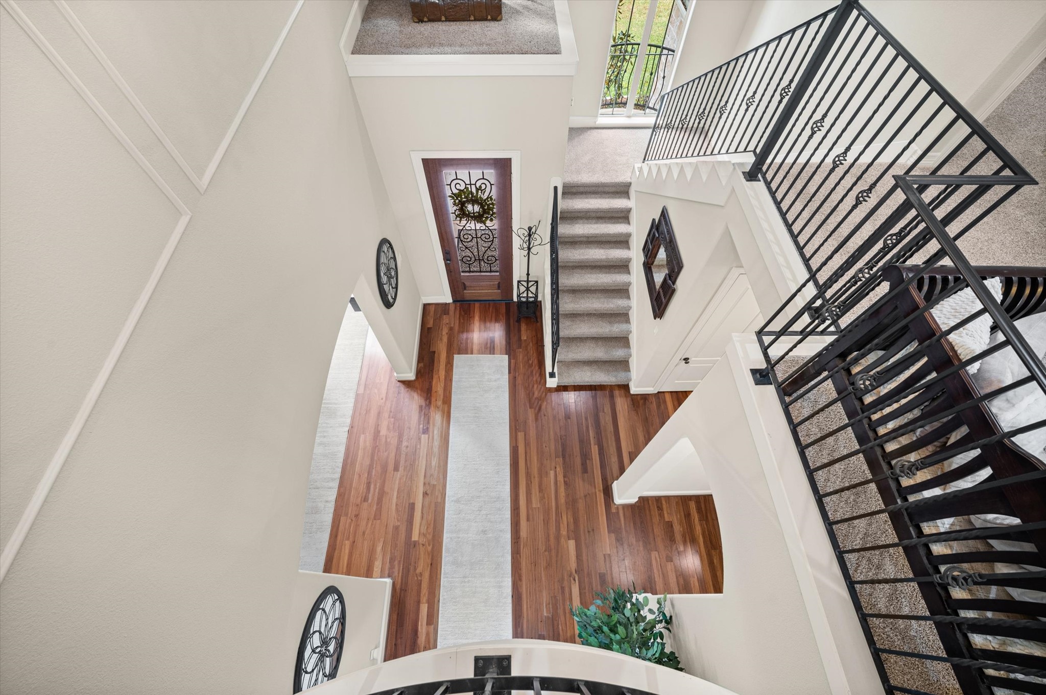 Beautiful overhead view of the home's open staircase and entryway
