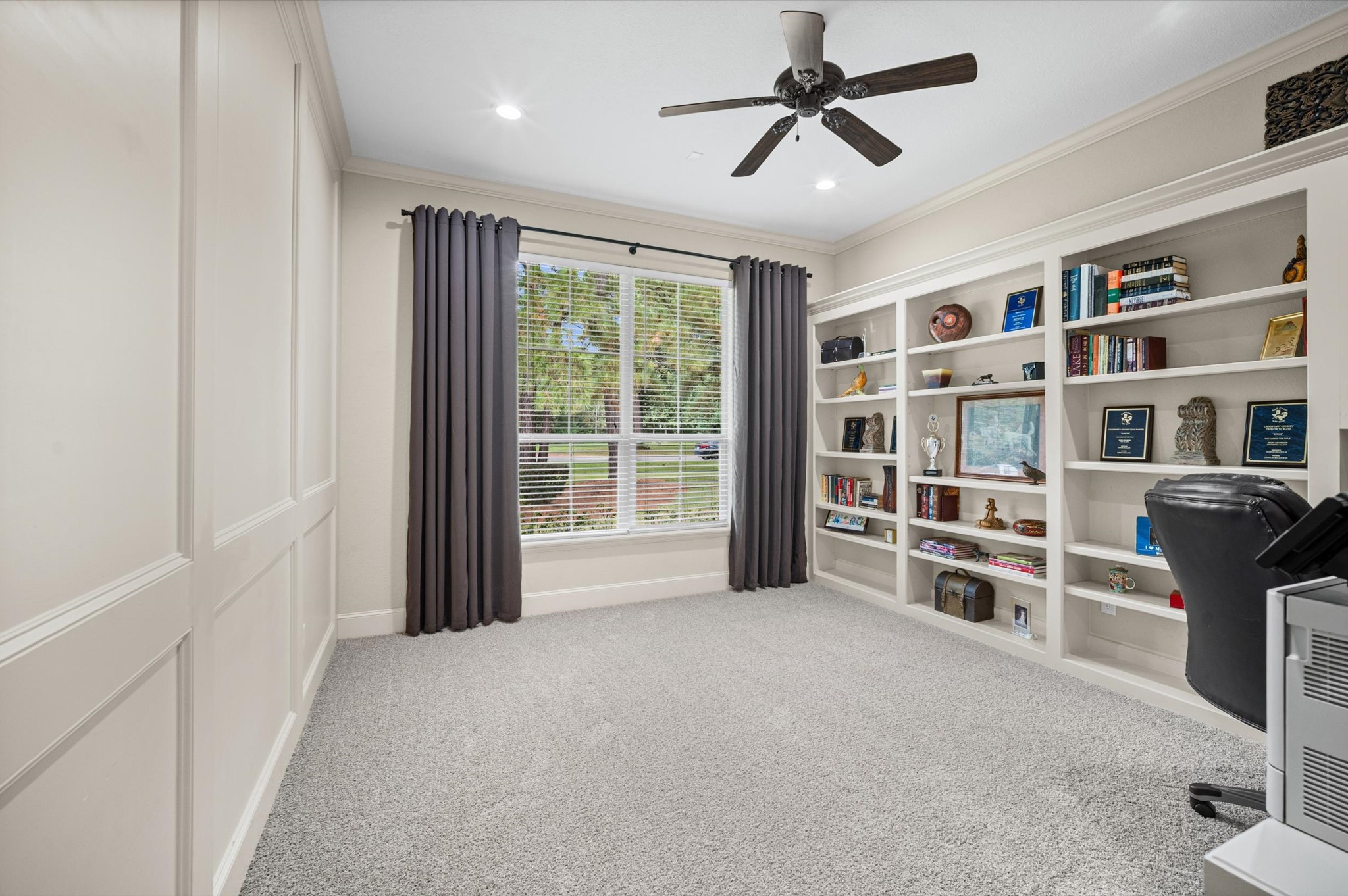 Beautiful built-in home office with custom cabinetry, desk space and abundant storage