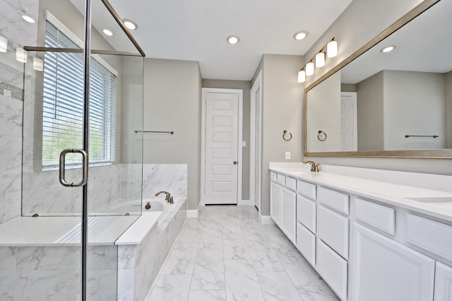Wow! Now this Primary Suite Bathroom has that Wow Factor throughout! Look at all those Cabinets and Draws for all your storage need!