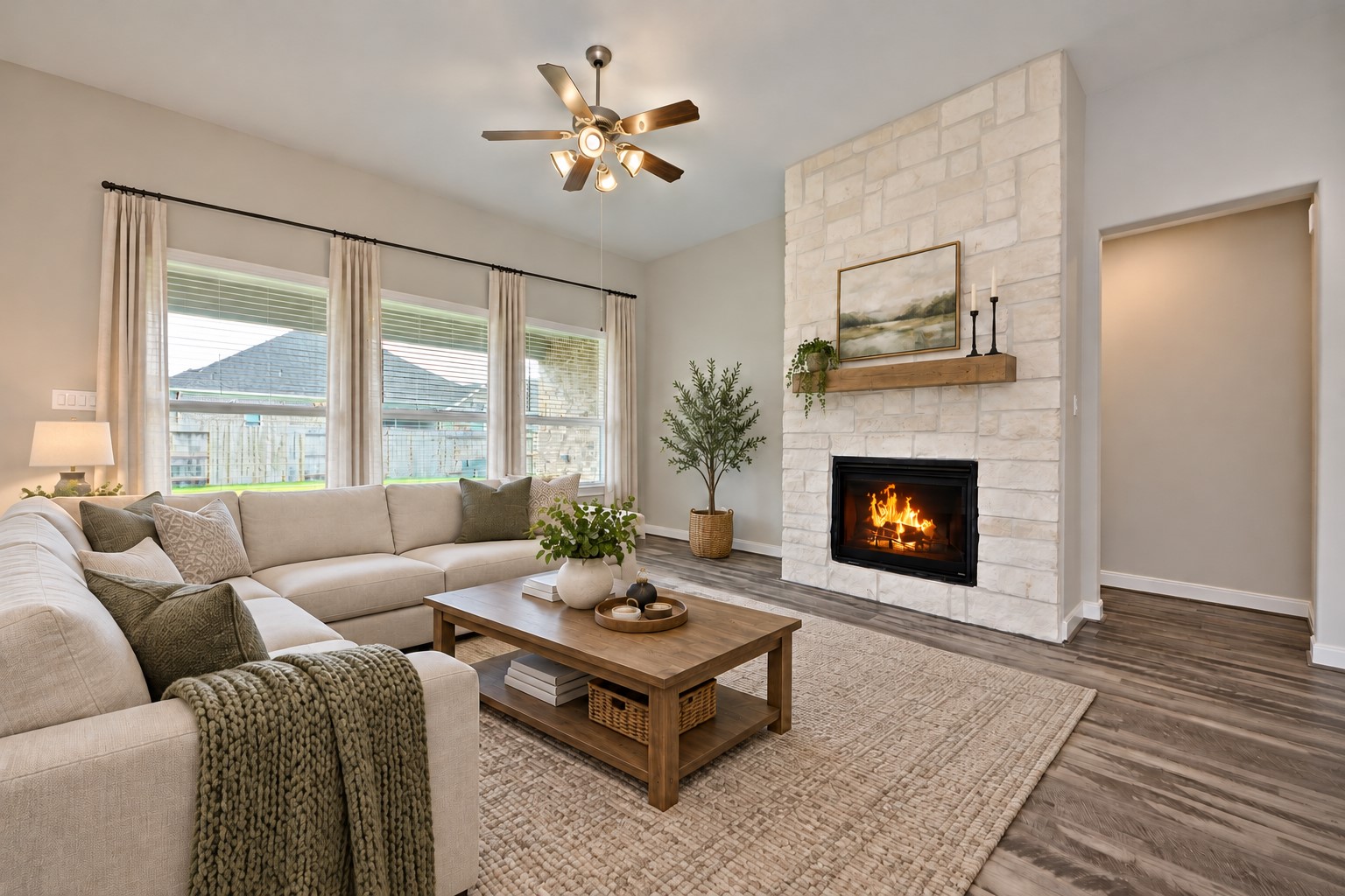 Fabulous Family Room with High Ceilings and with Ceiling Fan then notice the amazing Walls of Windows, but that is not all Huge Stone Main Focus Point Fireplace with Fire Logs for those Chilly Winter Days! Main Primary Bedroom is tucked away down a private hallway! Notice no carpet in the Main Living Areas!!! Easy upkeep!