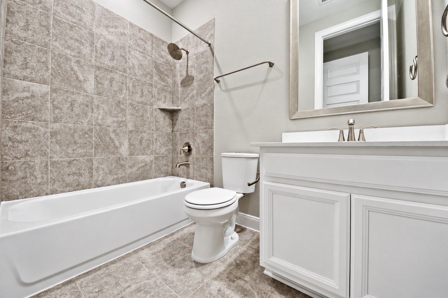 Guest Bathroom on the Right Hand Side has Upgraded Vanity with Deep Under-mount Sink, Beautiful Quartz Counter Tops, Tug and Shower Combination with Upgraded Tile Surroundings! All Bathrooms feature: High-Performance Toilets, Water-Efficient Faucets and Flow-Smart Shower-heads!