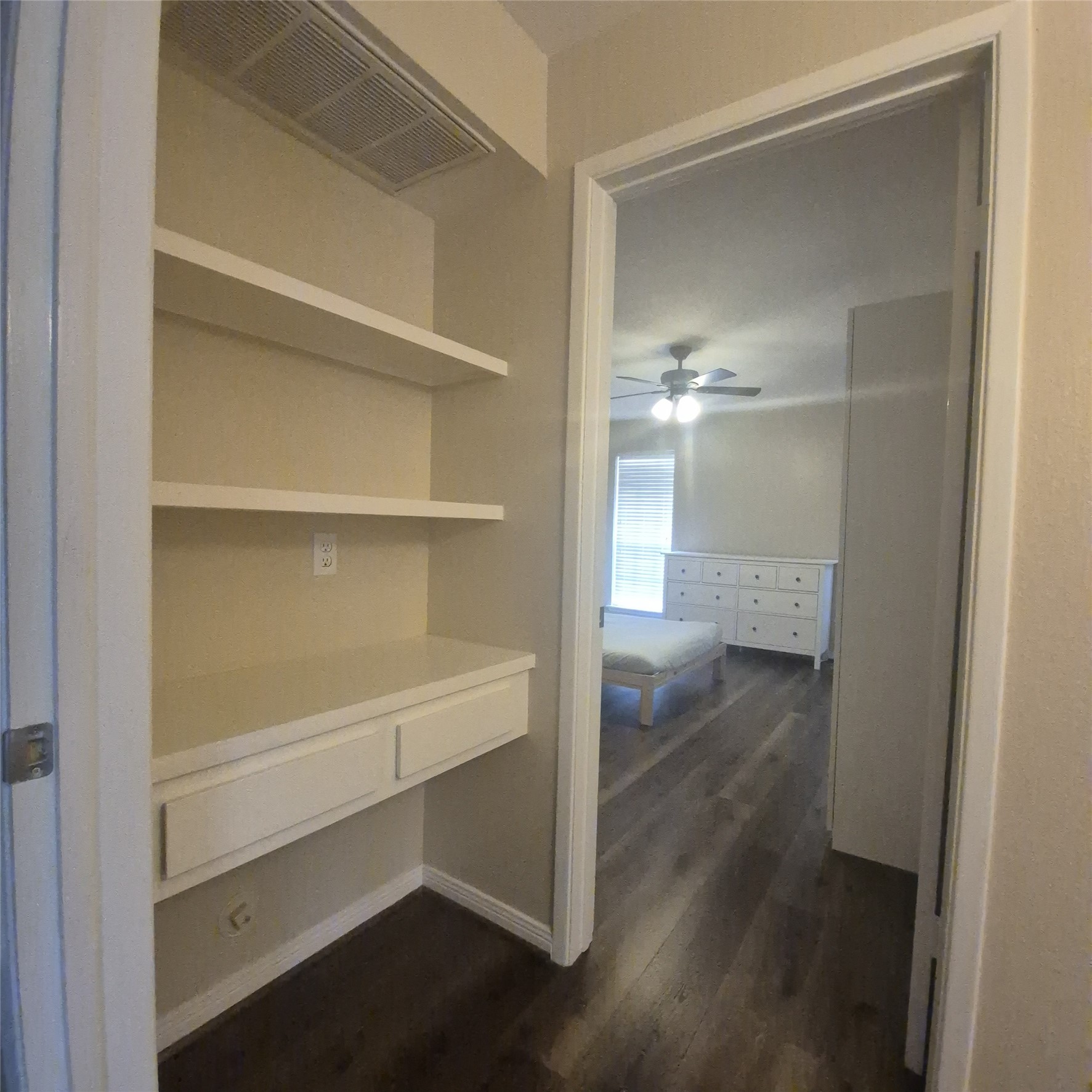 View into Primary bedroom from top of stairs