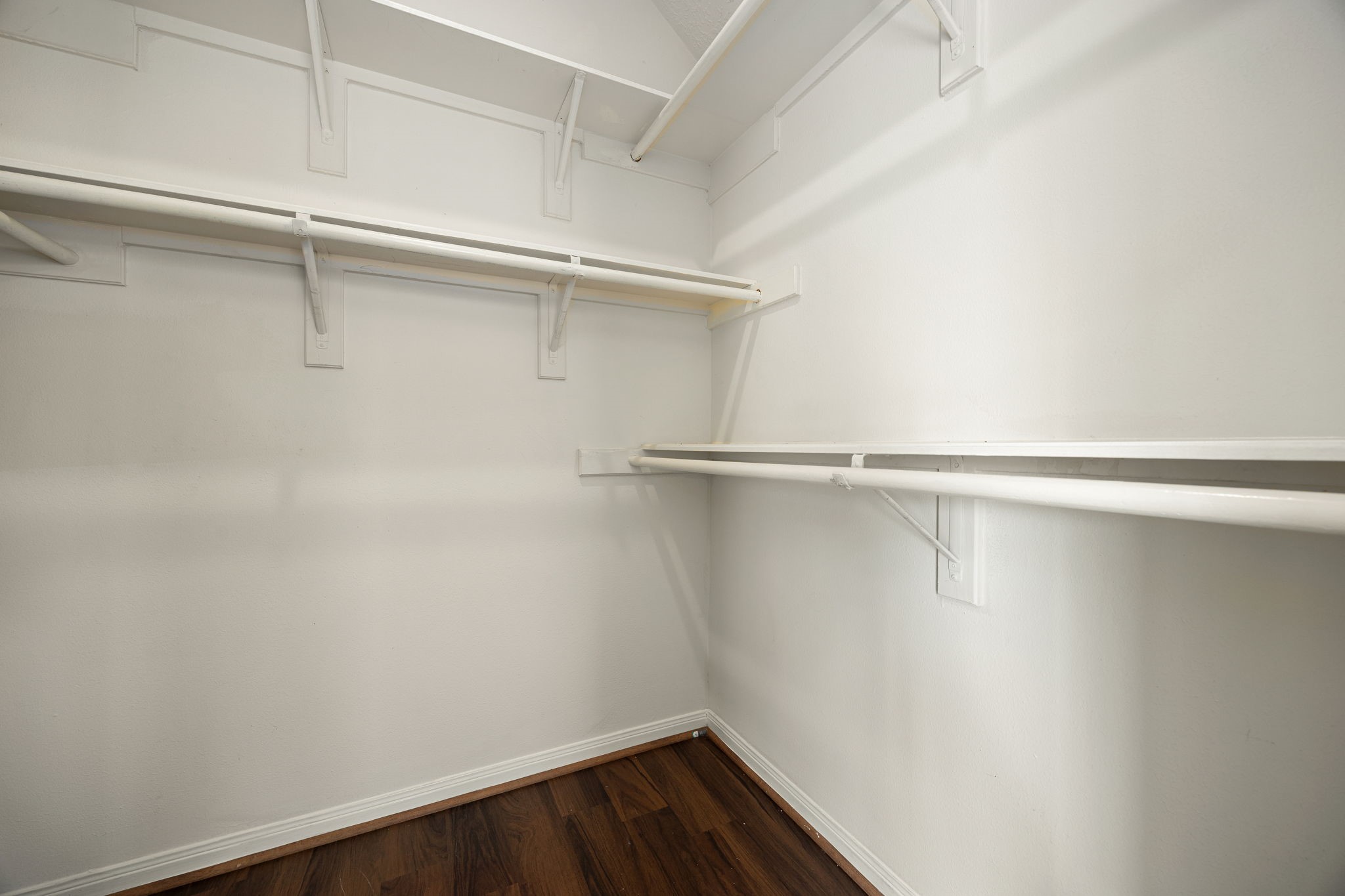 The primary suites walk-in closet offers generous shelving and hanging space to keep everything organized.