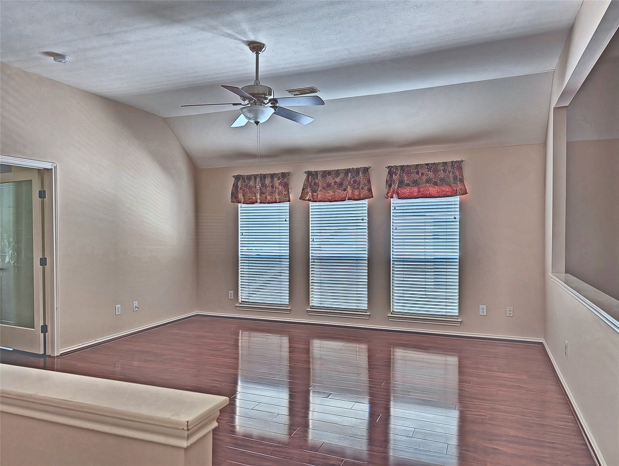 Massive upstairs game room / loft flex space with triple windows.