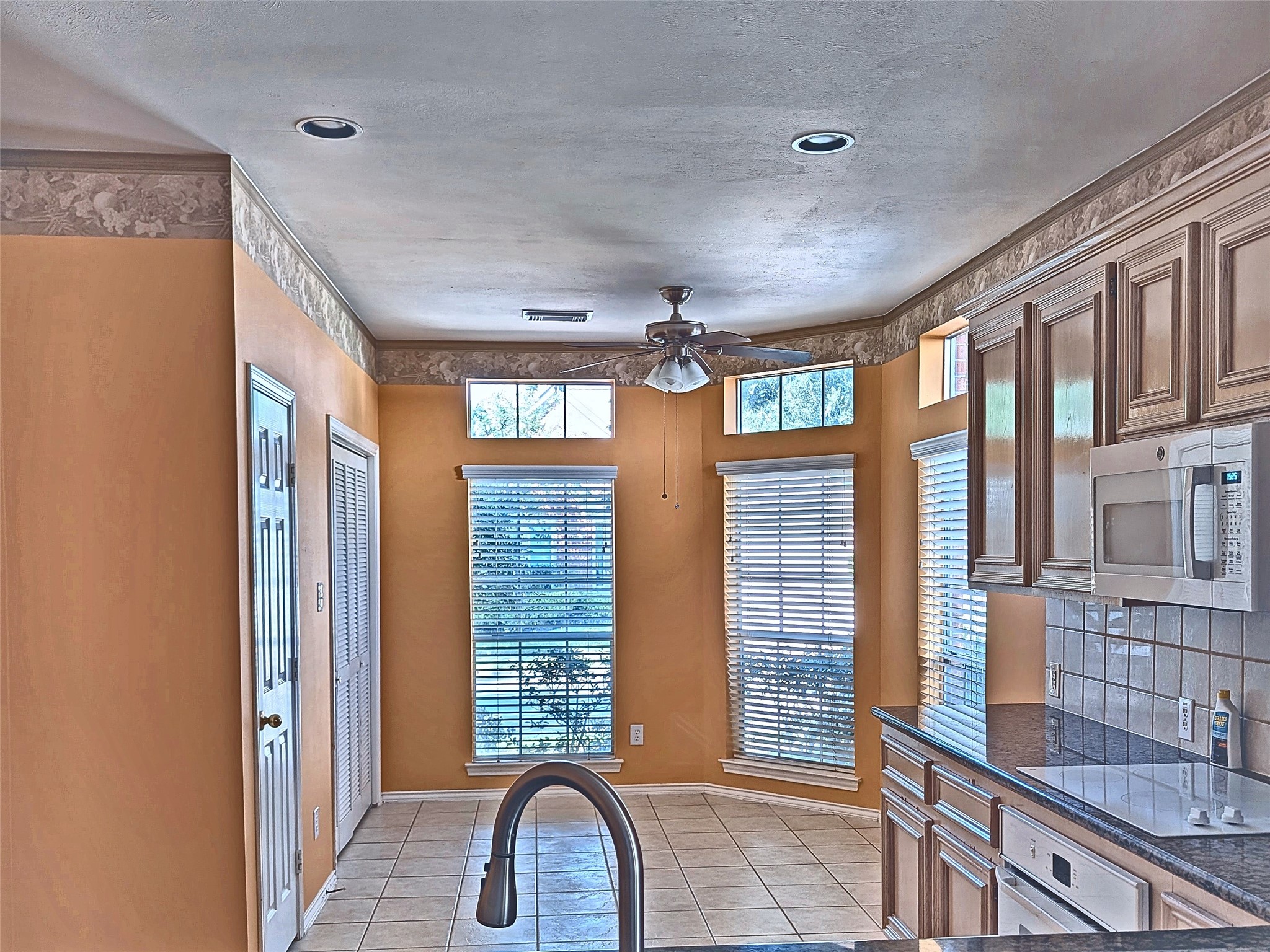 Chef's kitchen with raised breakfast bar and sunny bay window breakfast nook. Chef's kitchen with raised breakfast bar and sunny bay window breakfast nook.