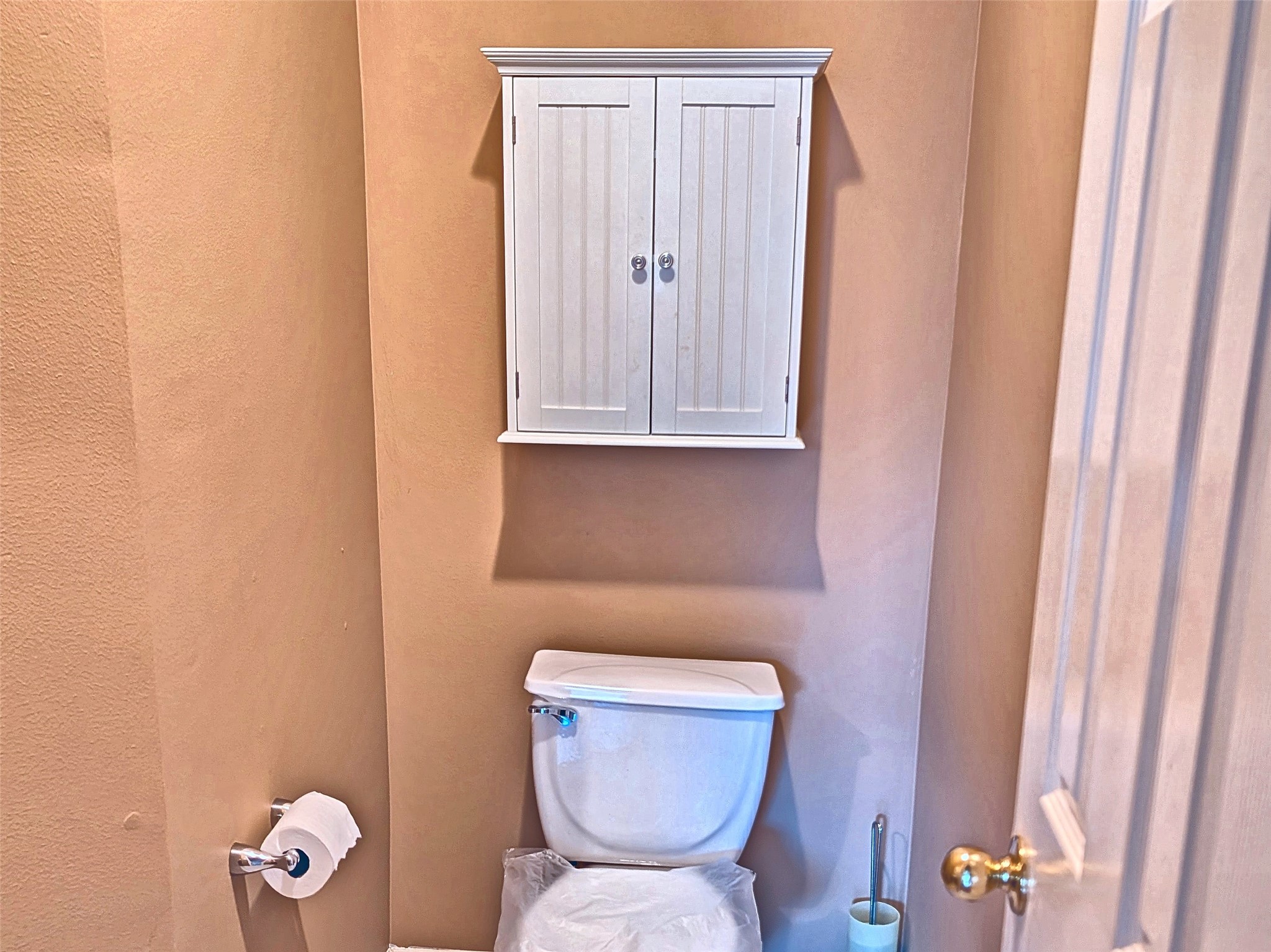 Convenient main-floor powder room with storage cabinet. Convenient main-floor powder room with storage cabinet.