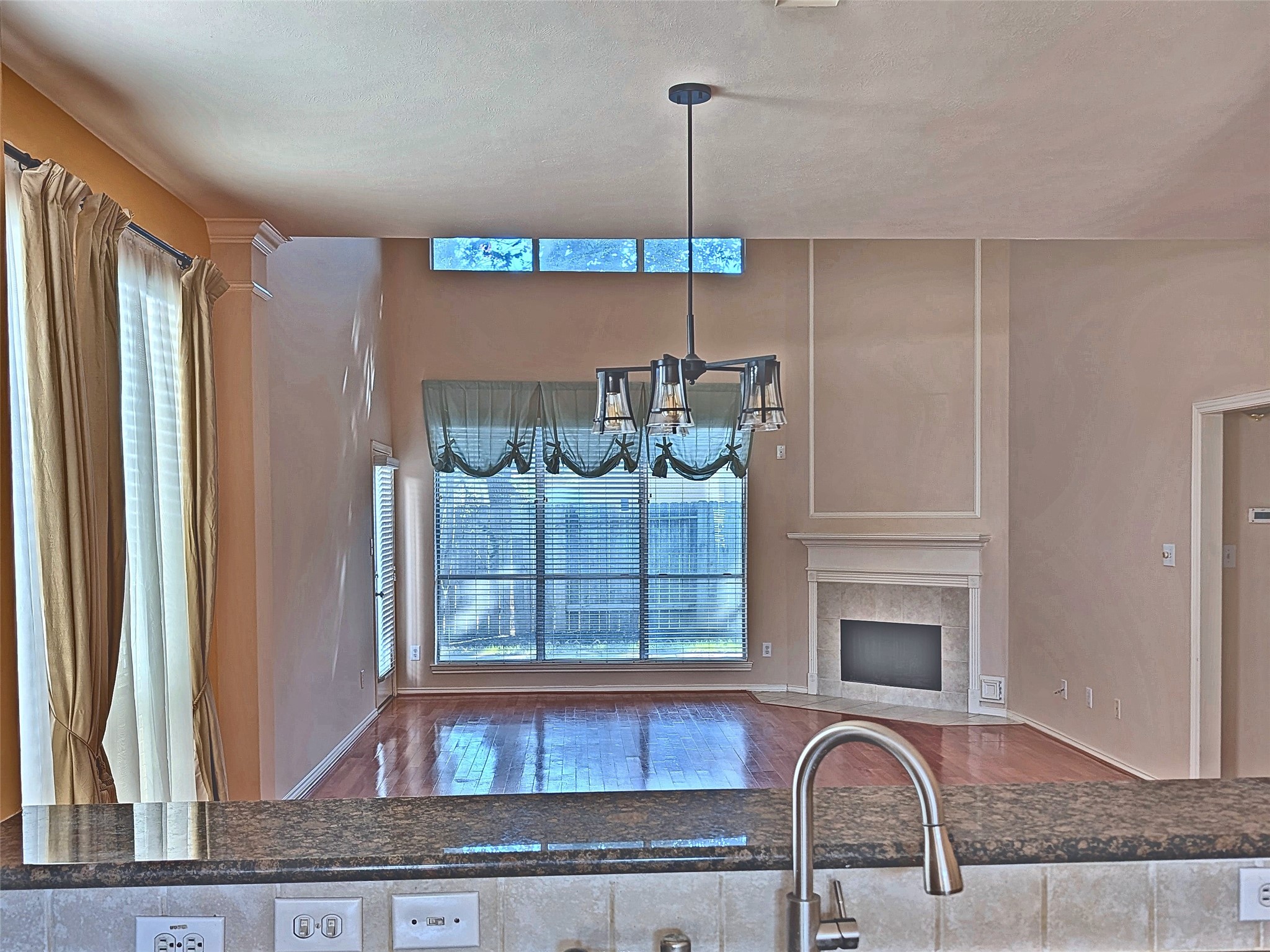 Open-concept layout connecting kitchen, dining, and family living areas Open-concept layout connecting kitchen, dining, and family living areas