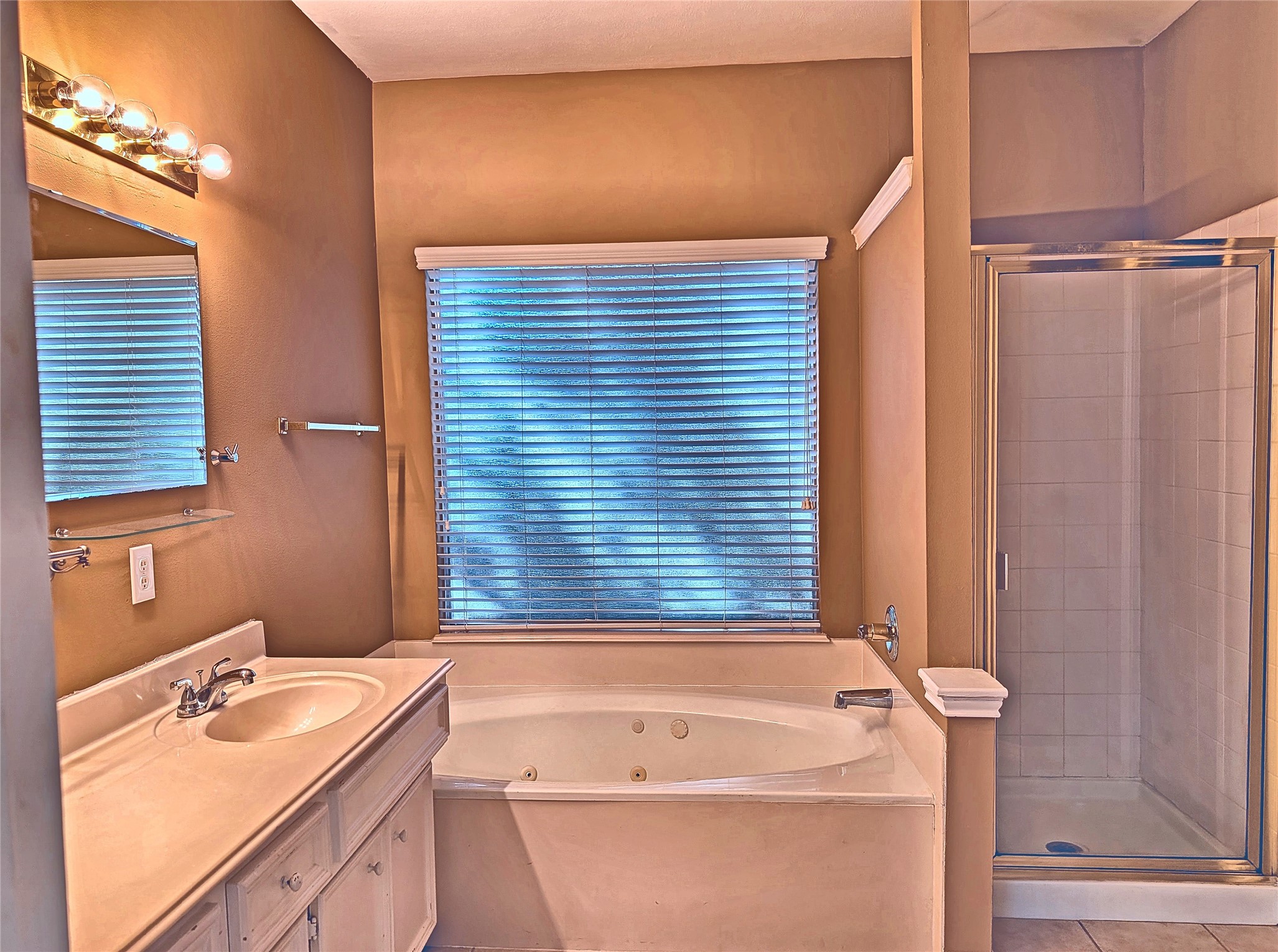 Ensuite primary bath with dual sinks, jetted soaking tub, and separate shower. Ensuite primary bath with dual sinks, jetted soaking tub, and separate shower.