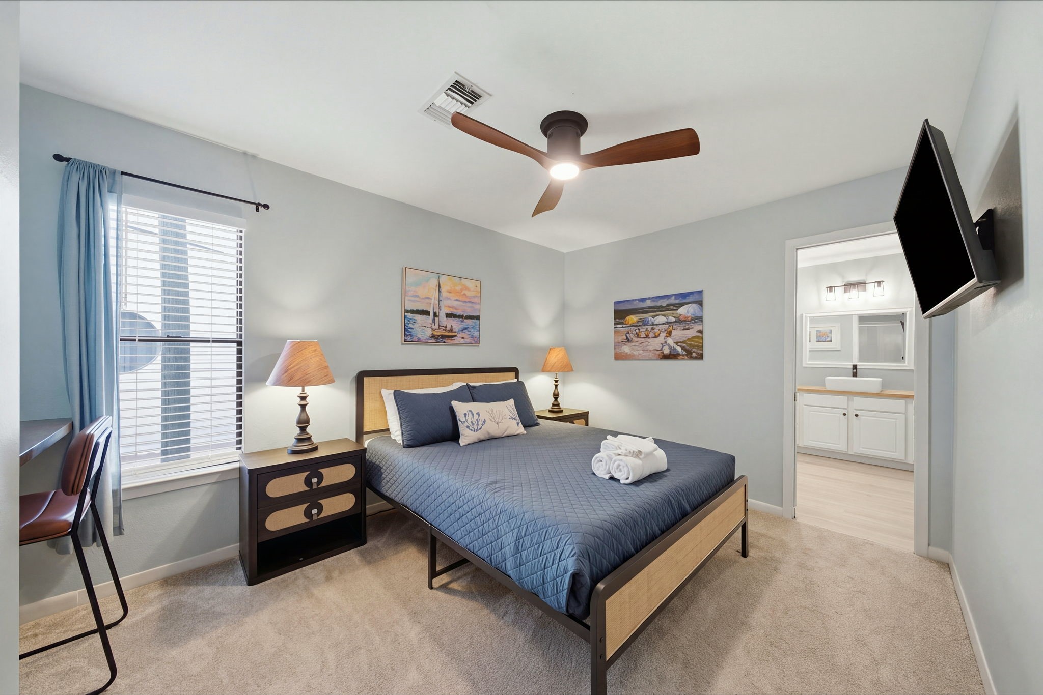 Second primary ensuite on main level, with private entrance to a 3rd deck off the bathroom, includes a built-in deskwork area.