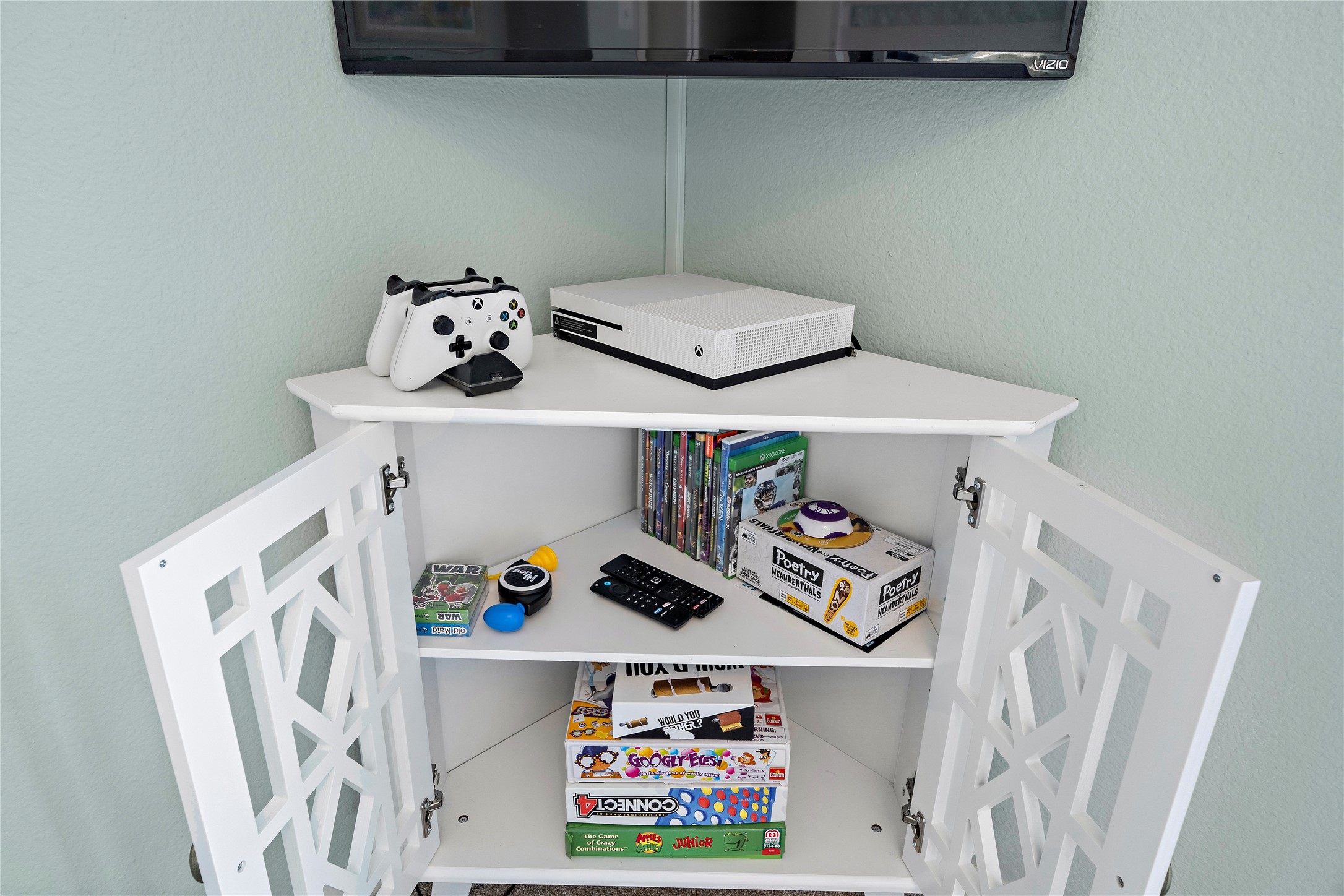 Game cabinet is fully stocked for hours of indoor entertainment.
