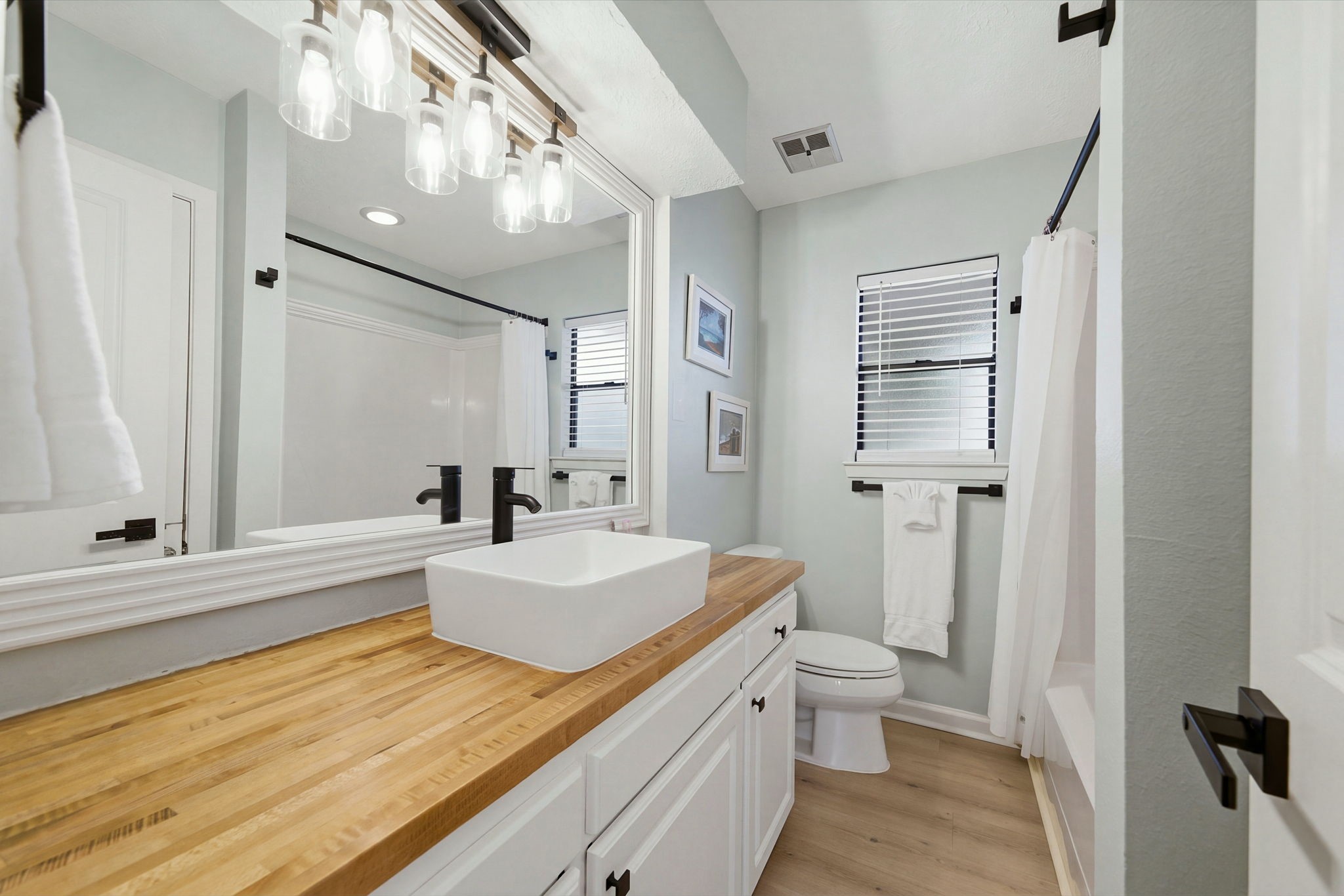Third of THREE full bathrooms with GORGEOUS remodel. Plus an extra half bath on ground level!