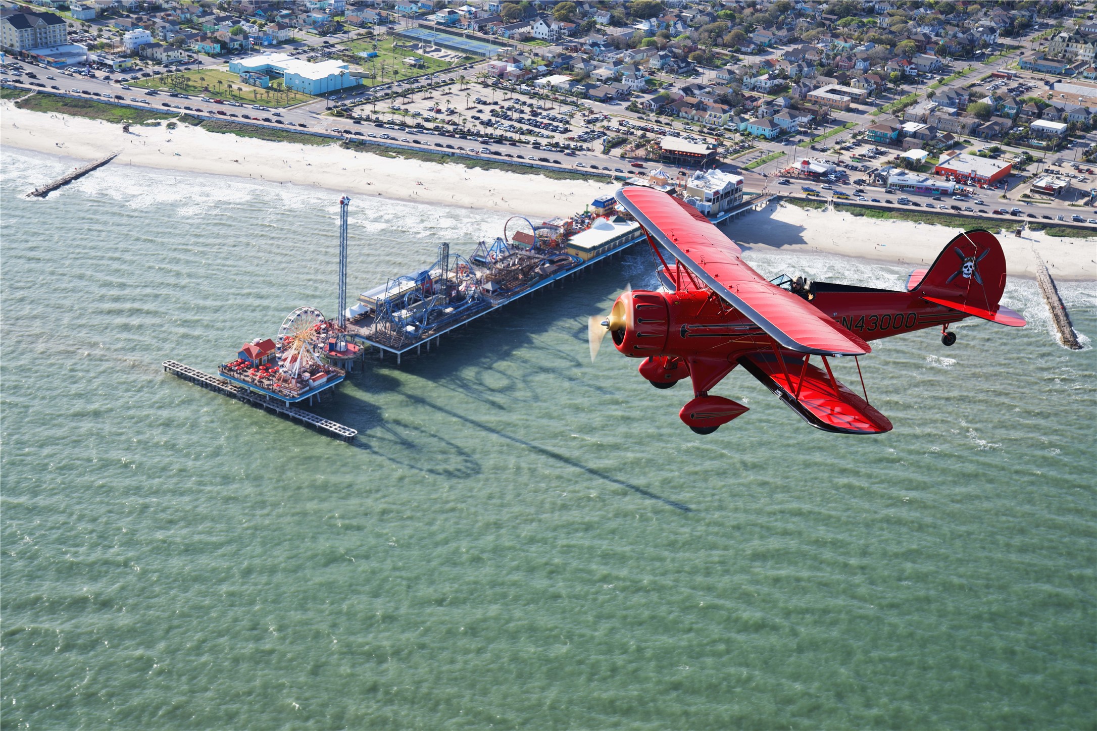 Hop in a Skallywag Air biplane for some incredible aerial coast views!