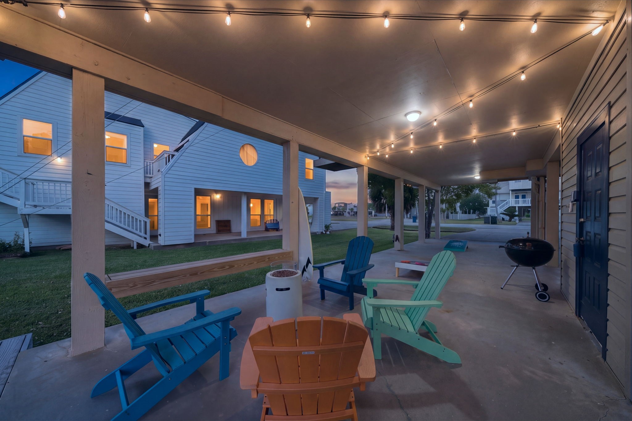 The fun continues on the ground level, with plenty of parking & grassy entertaining areas. Fire pit & cornhole helps pass the time.