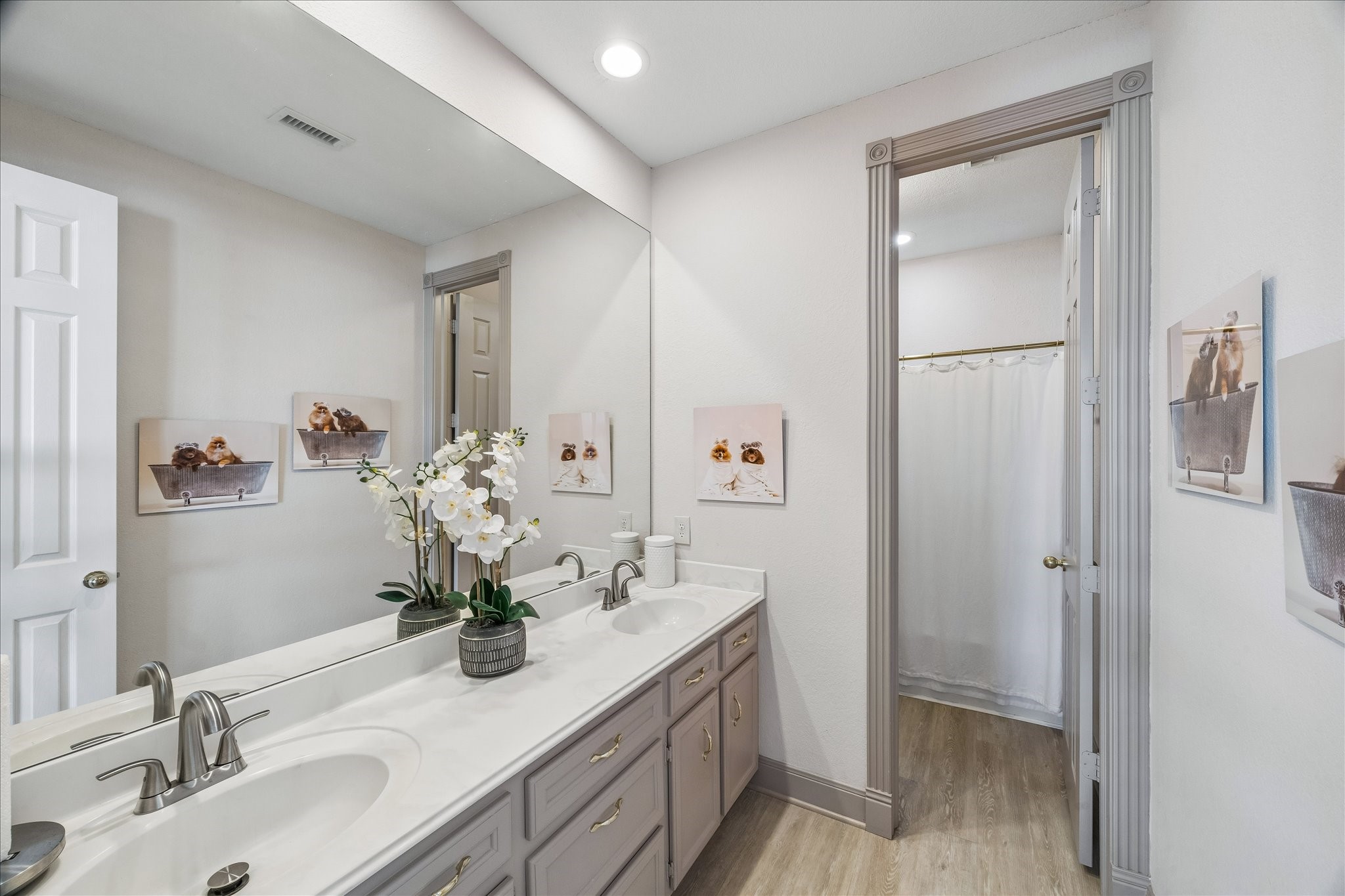 2nd Primary Bedroom full bath with double sink. New faucets & towel bars have been added.