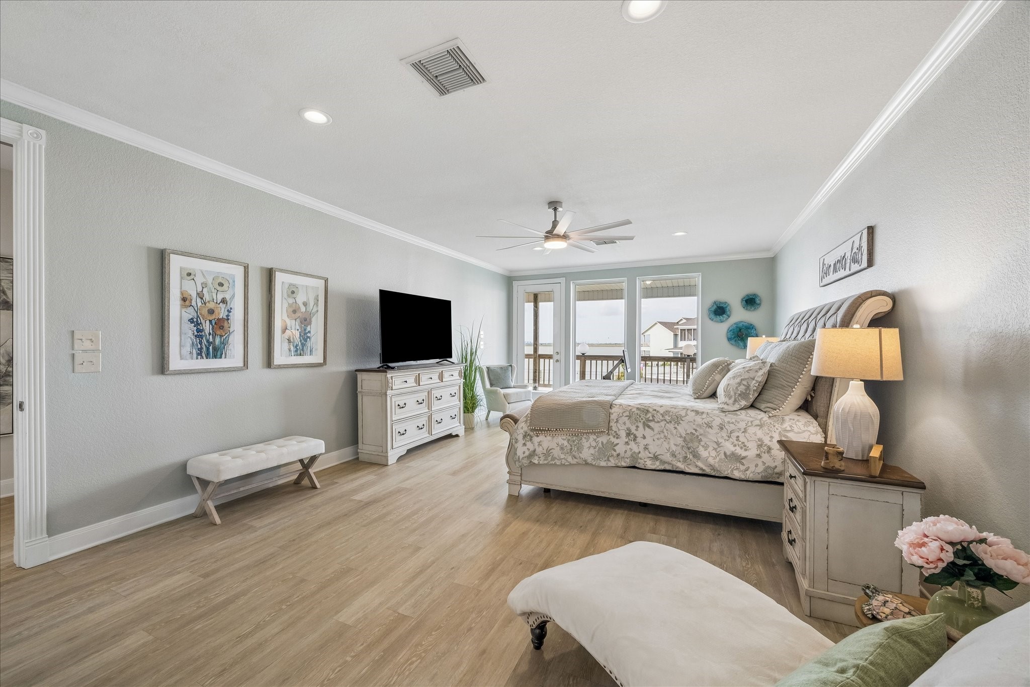 This 3rd level first primary bedroom retreat offers a peaceful setting to enjoy the stunning waterfront views.
