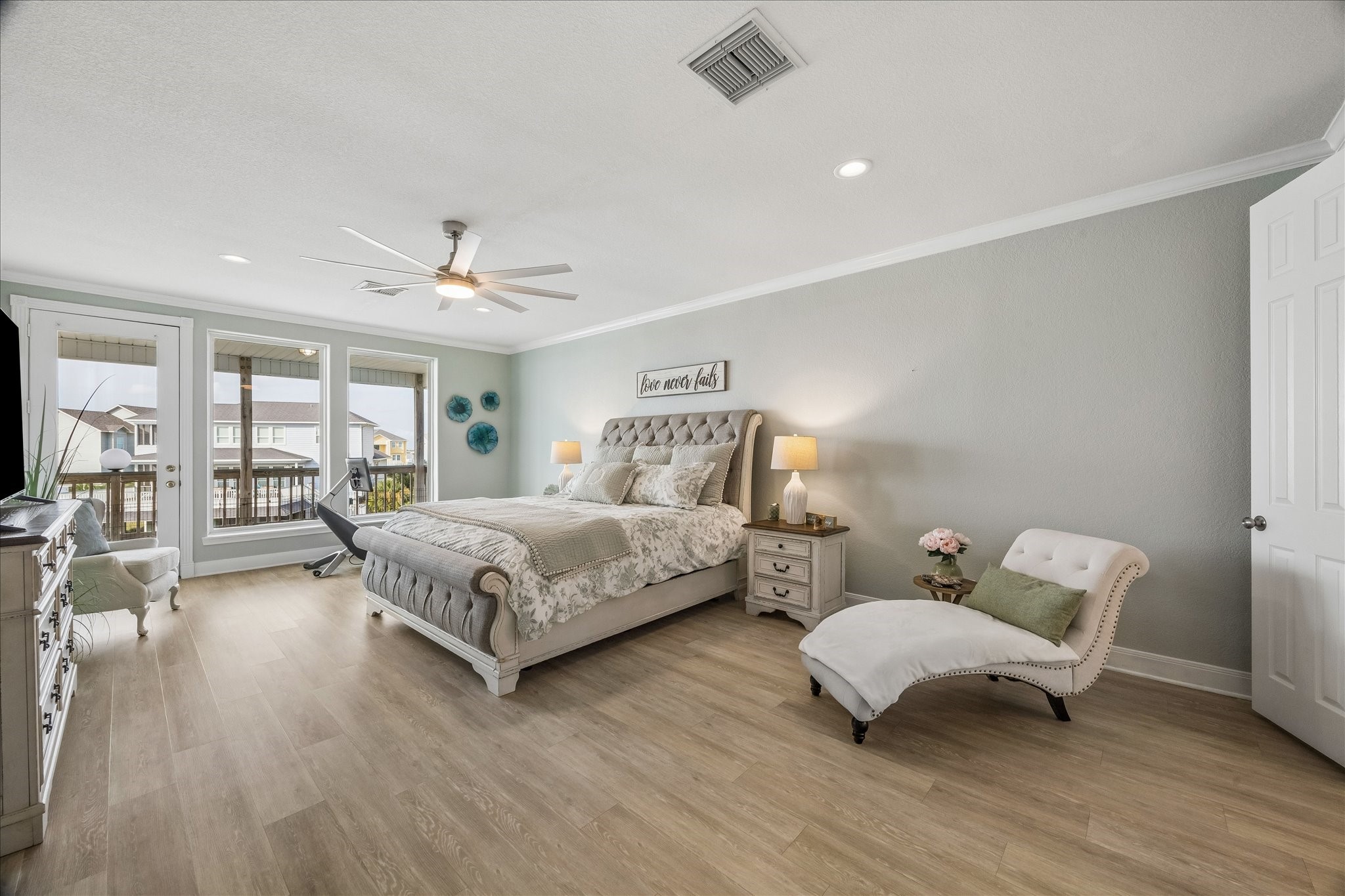 On the 3rd level you will find the first primary suite, featuring vinyl wood look flooring, private balcony access overlooking Jones Bay, and dual primary closets...An incredible retreat!
