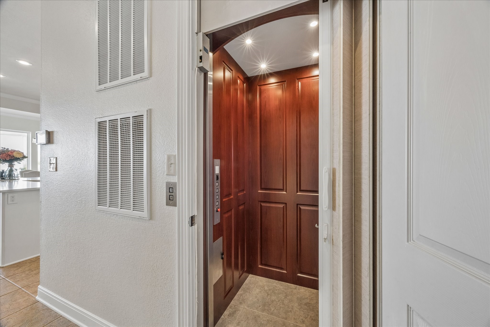 In home ELEVATOR provides access to all levels for added convenience & for groceries!