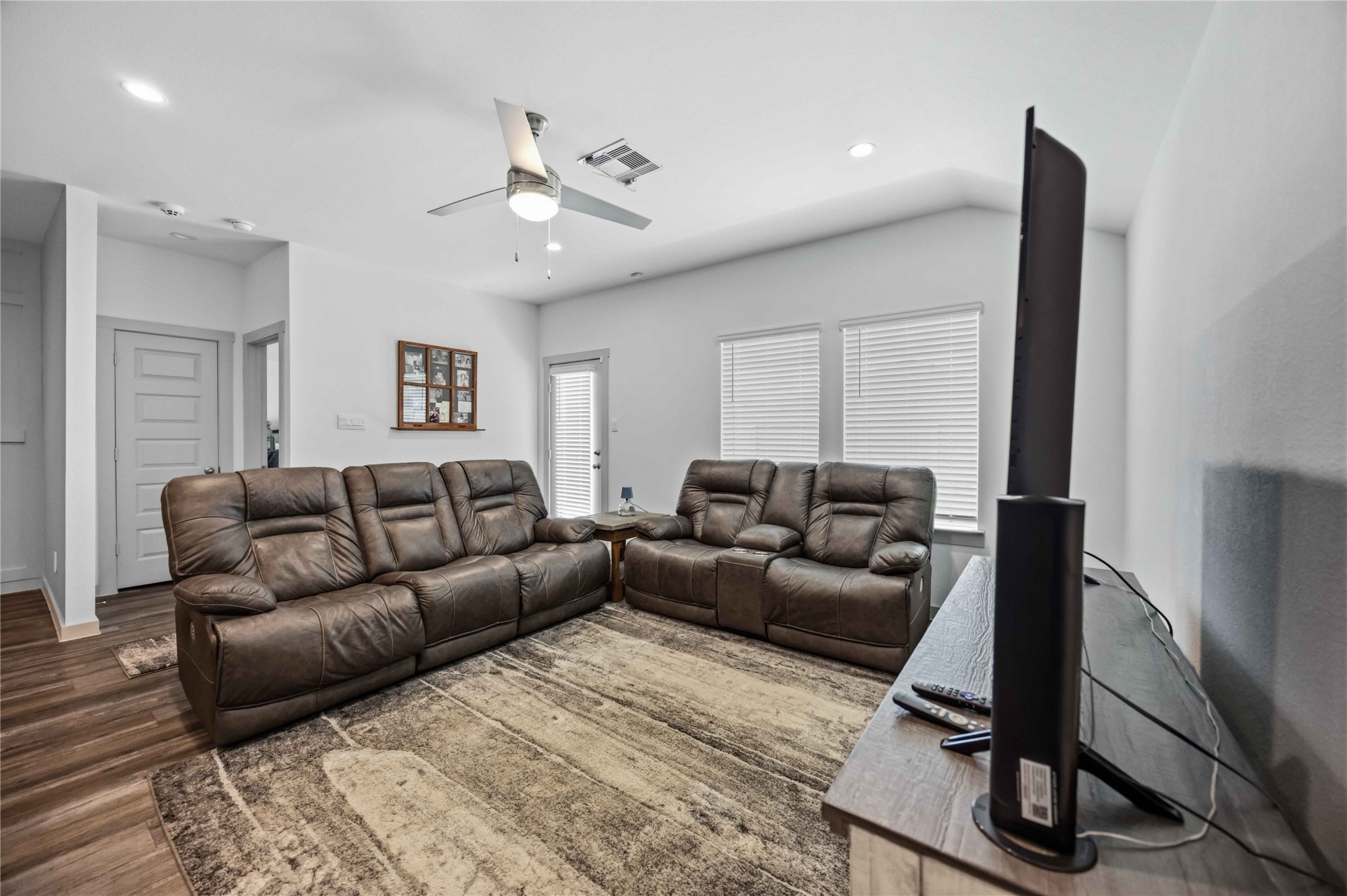 The living room is spacious enough for the whole family plus some.