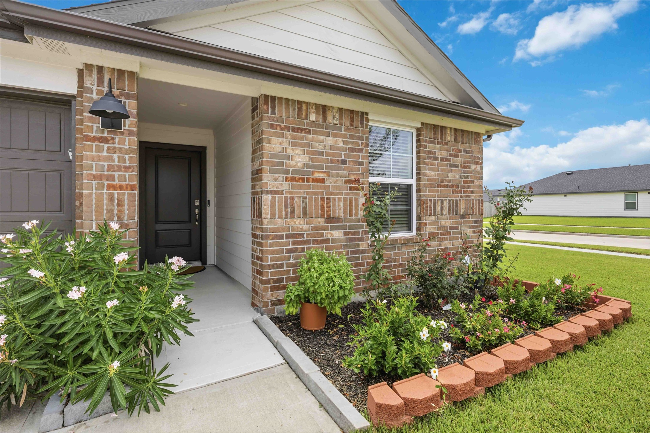 Great Corner lot with upgraded flowerbeds.