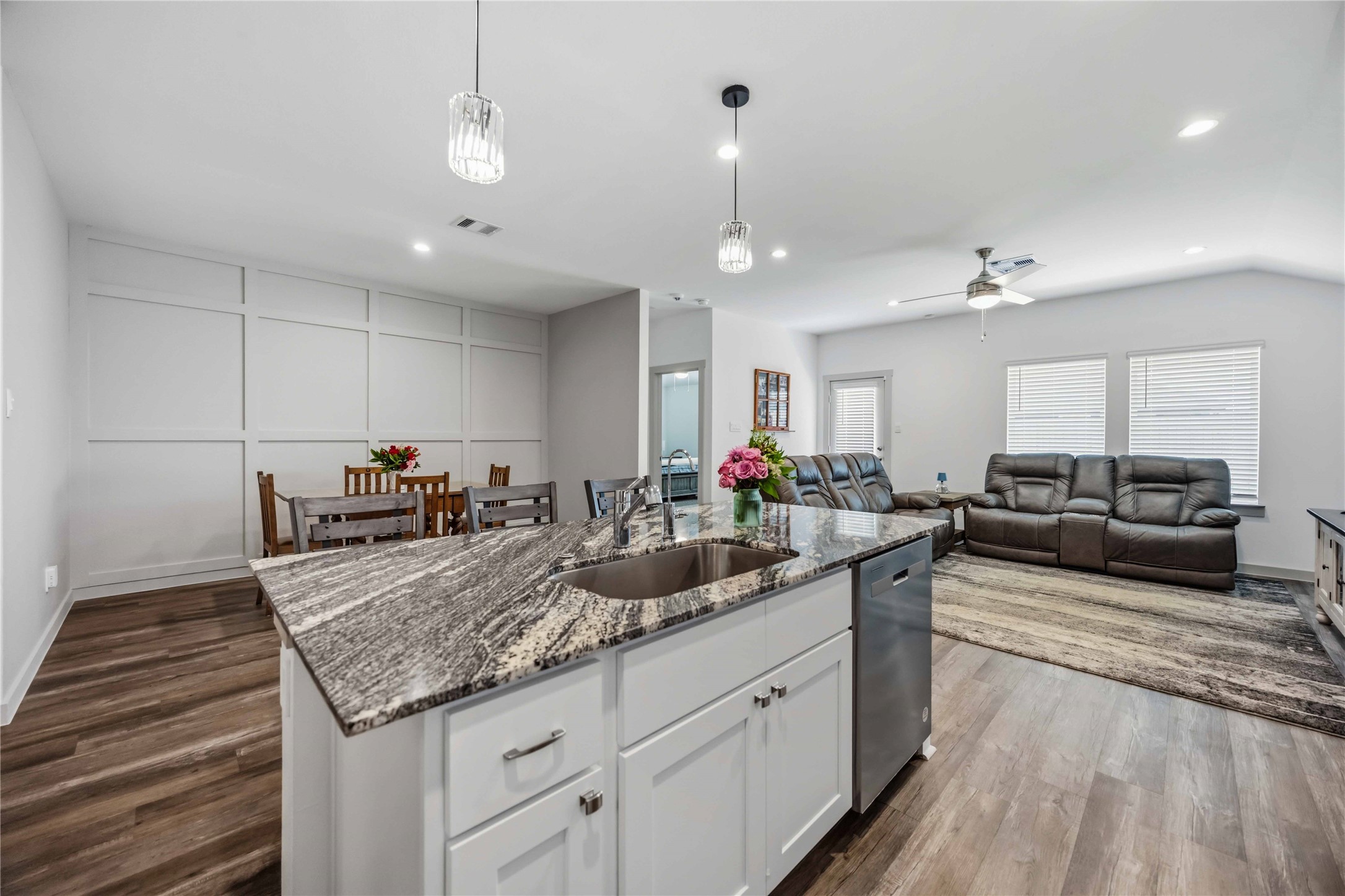 The dining room offers a custom accent wall and don't forget how amazing the pendant lights are over the bar.