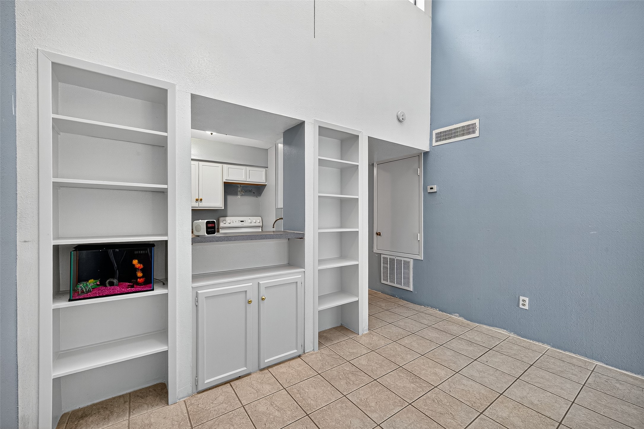 Functional built-in storage or bookshelf.
