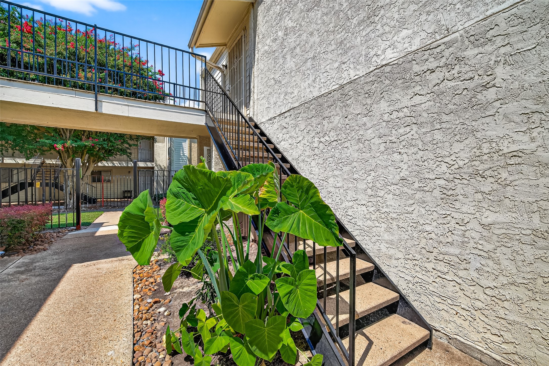 Stairs going up to the condo on the left.