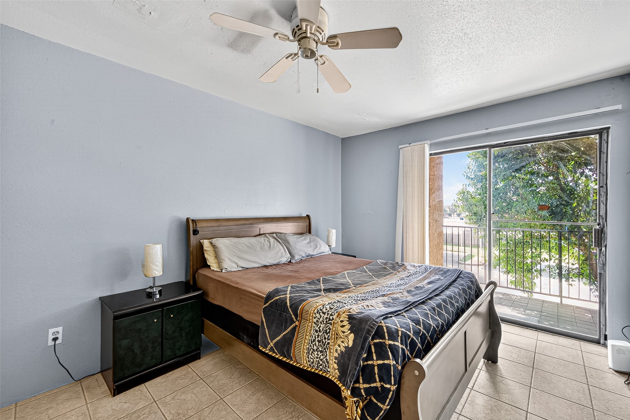 Spacious bedroom with access to the patio area.