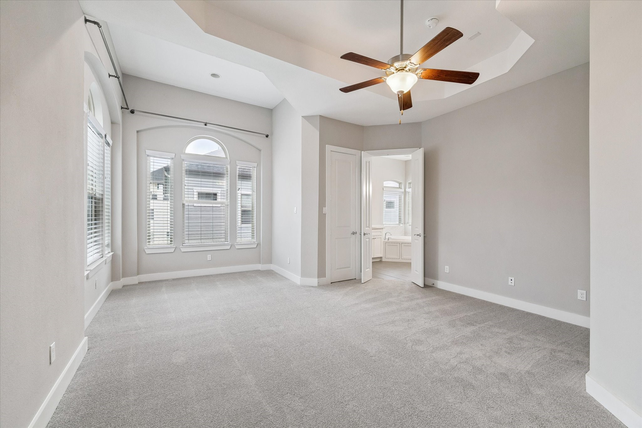 Extremely spacious primary suite with 2 walk-in closets and a sitting area.