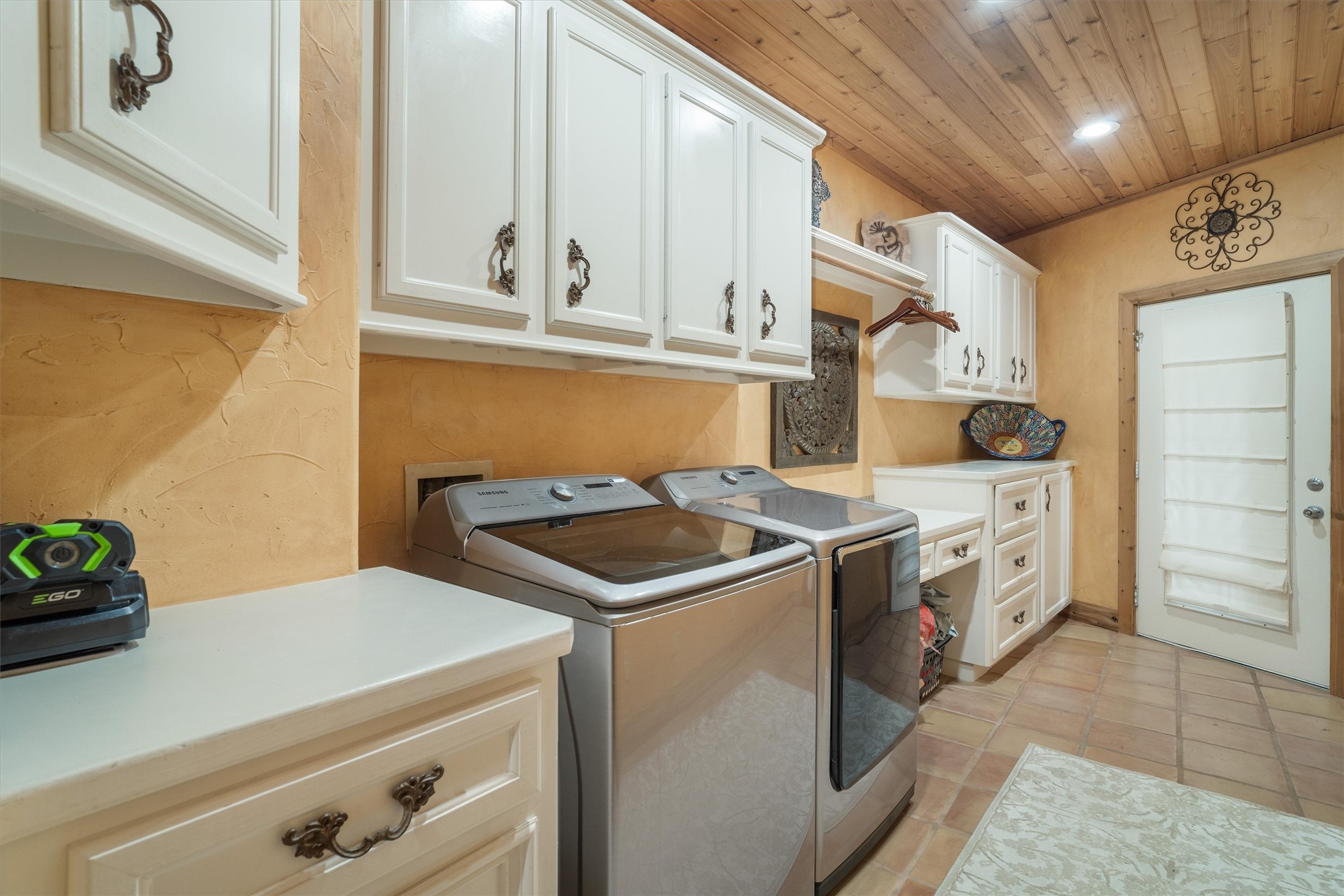 Laundry room with overhead storage/counter space