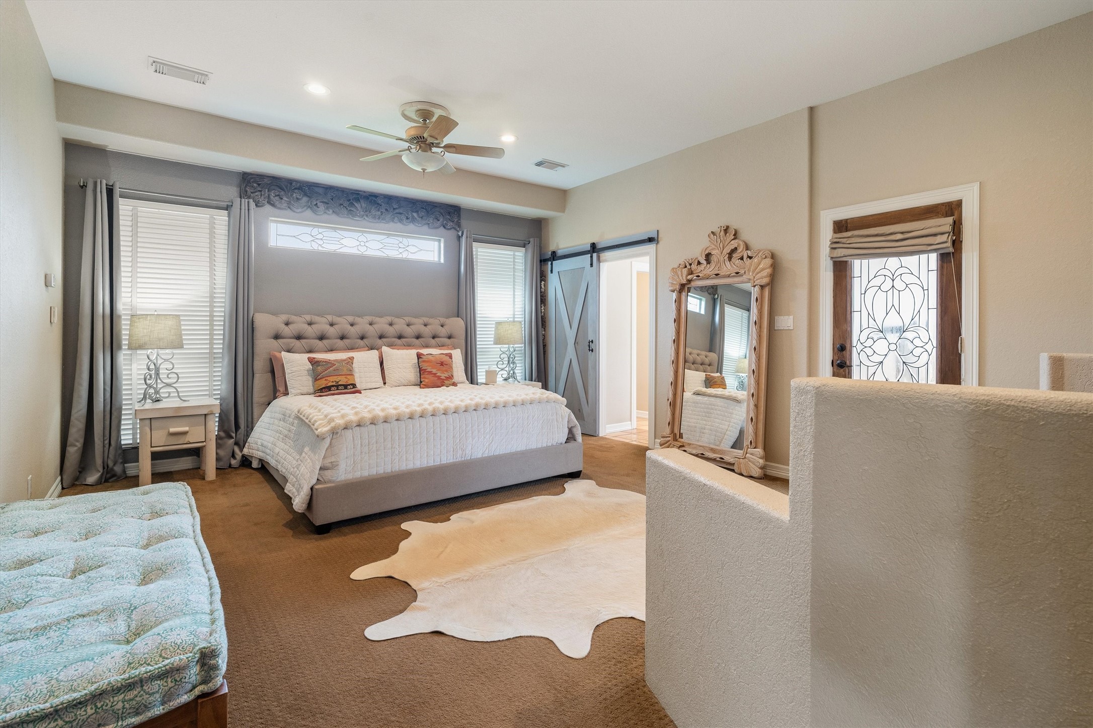 Primary bedroom with en suite- entry accented with beautiful barn door